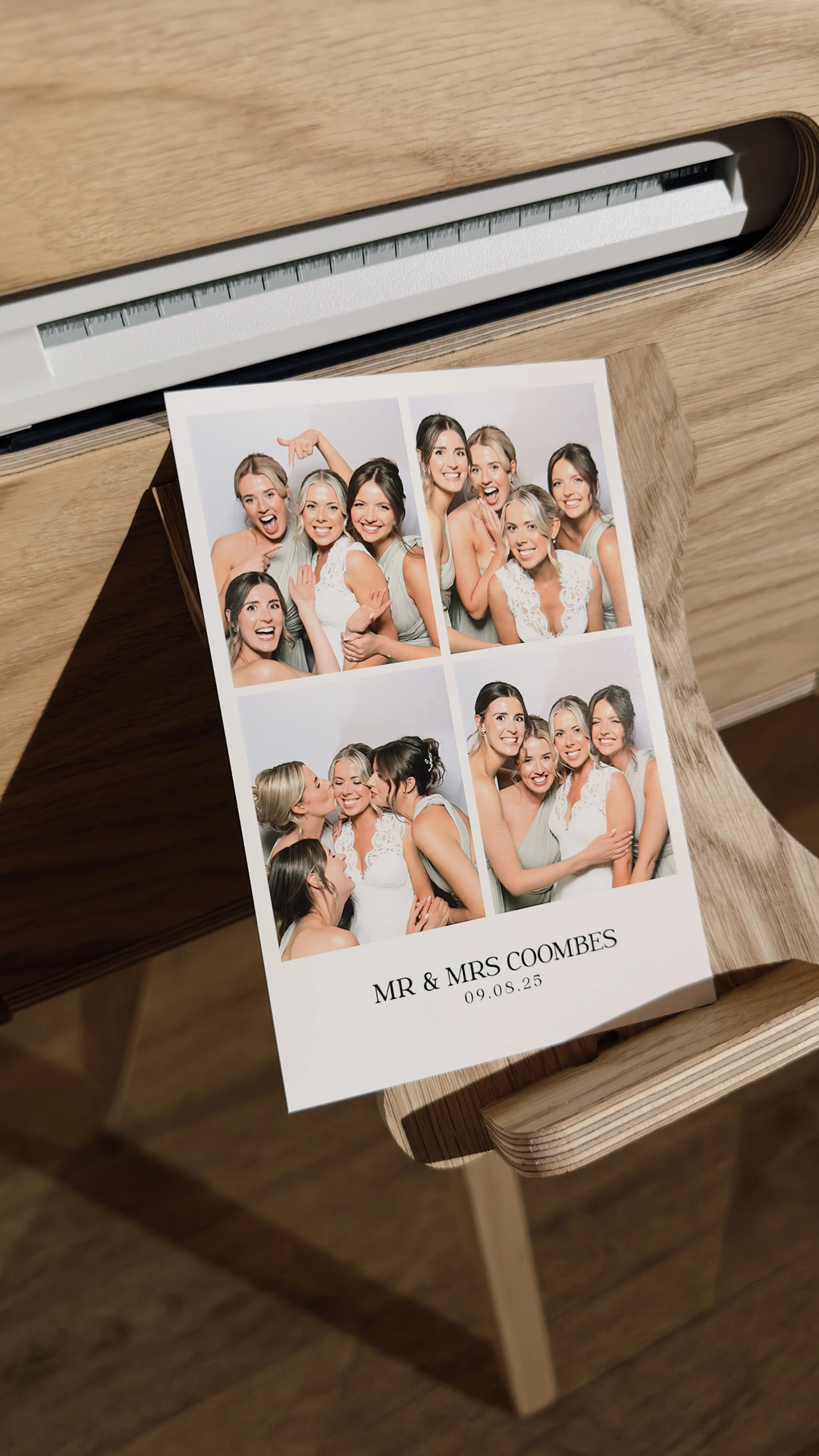 Photo booth strip of six women celebrating a wedding, with the text "Mr & Mrs Coombes 09.08.25" at the bottom.