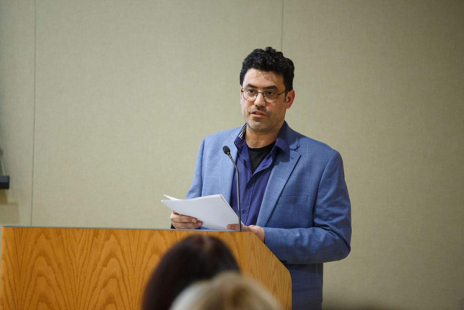 Professor Yuval Evri reading from an academic paper