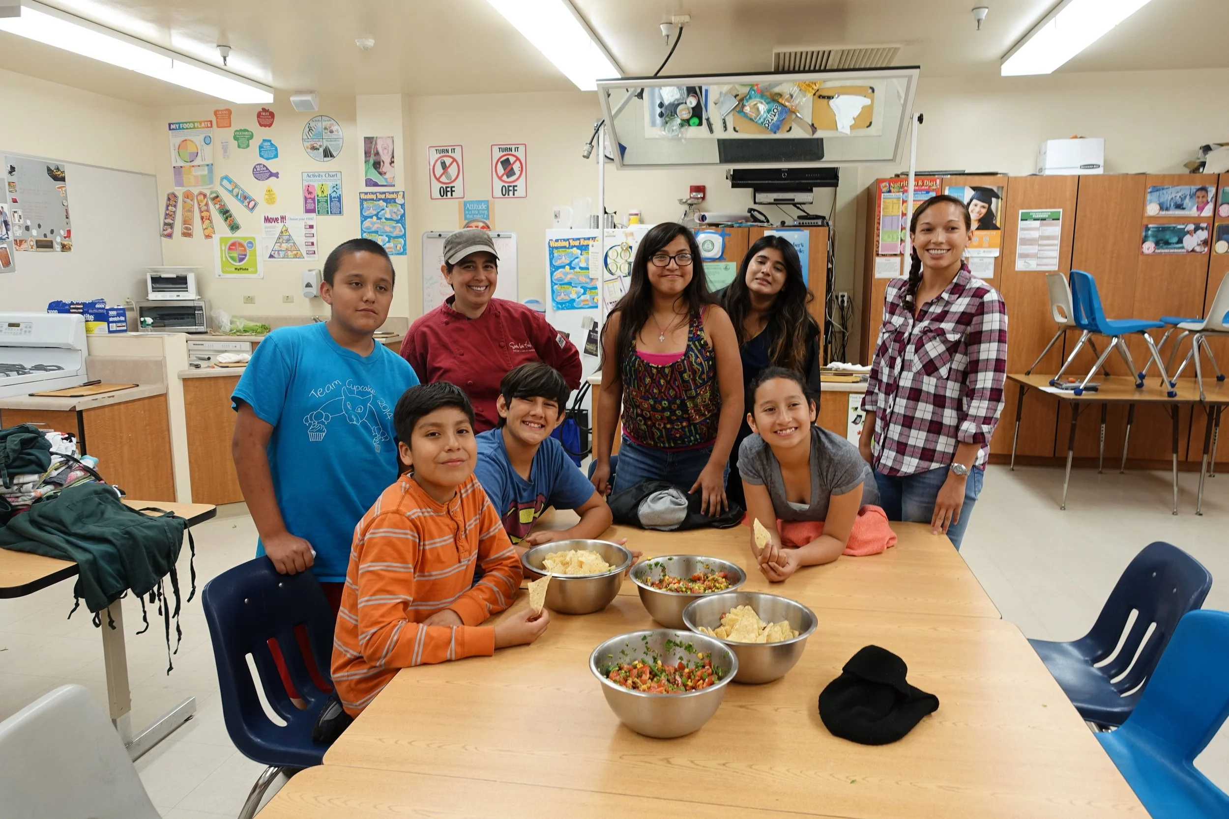 Group of students with Fairley and Christy (surrounding table).JPG