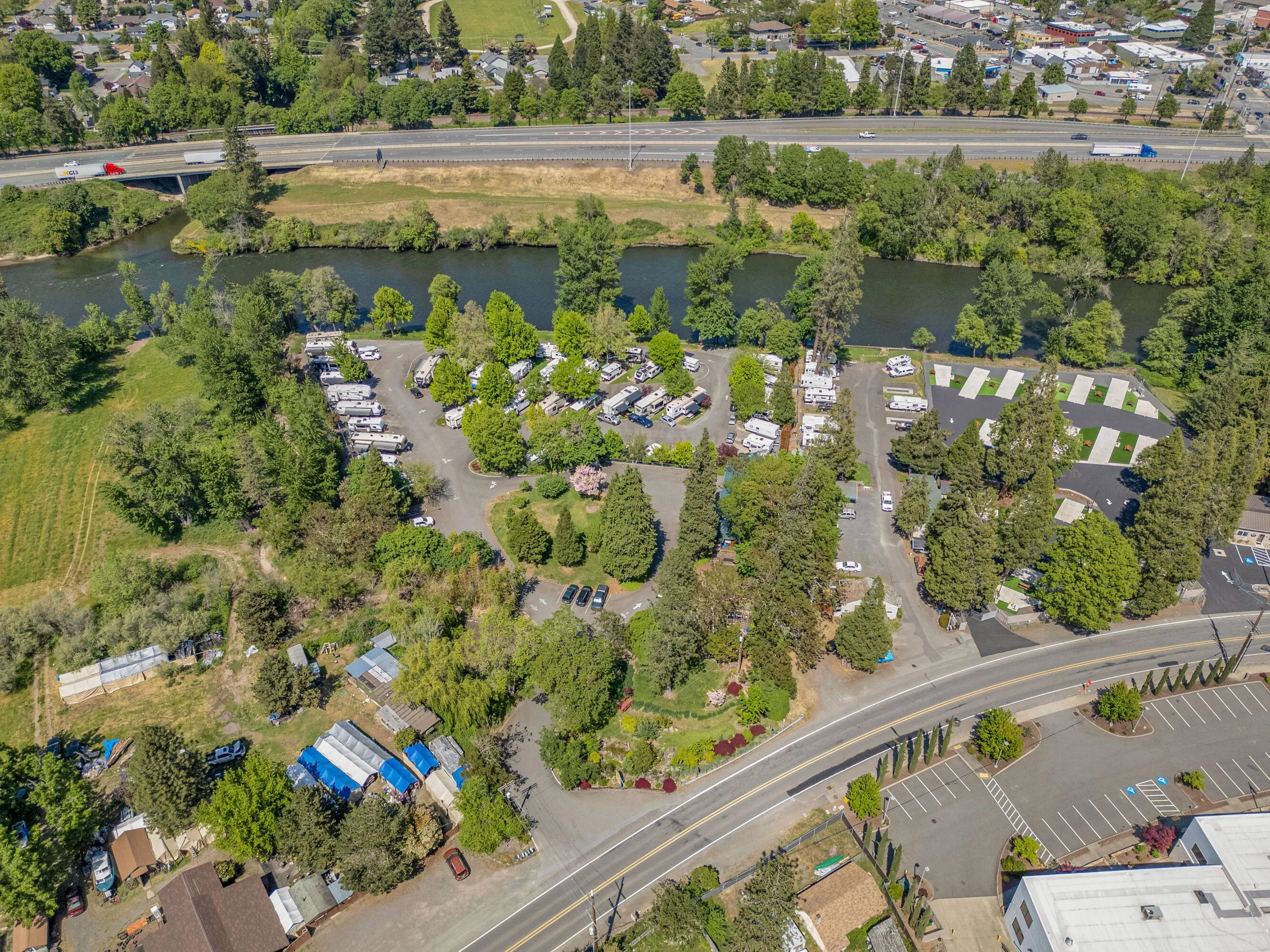 Aerial view of lush RV park on the Rogue River
