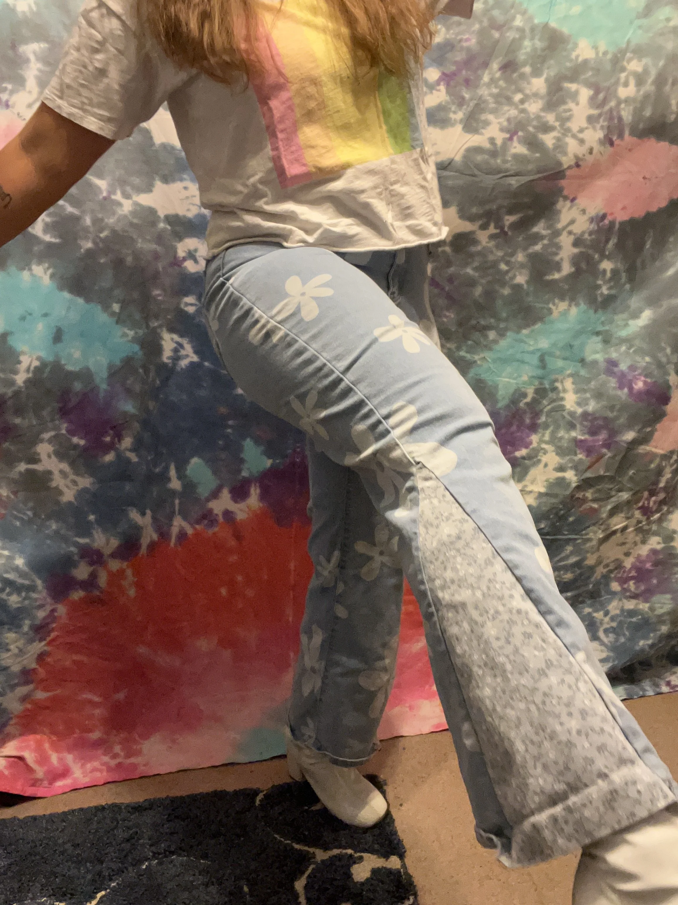 Flower printed denim bell-bottoms with light blue floral flare detail