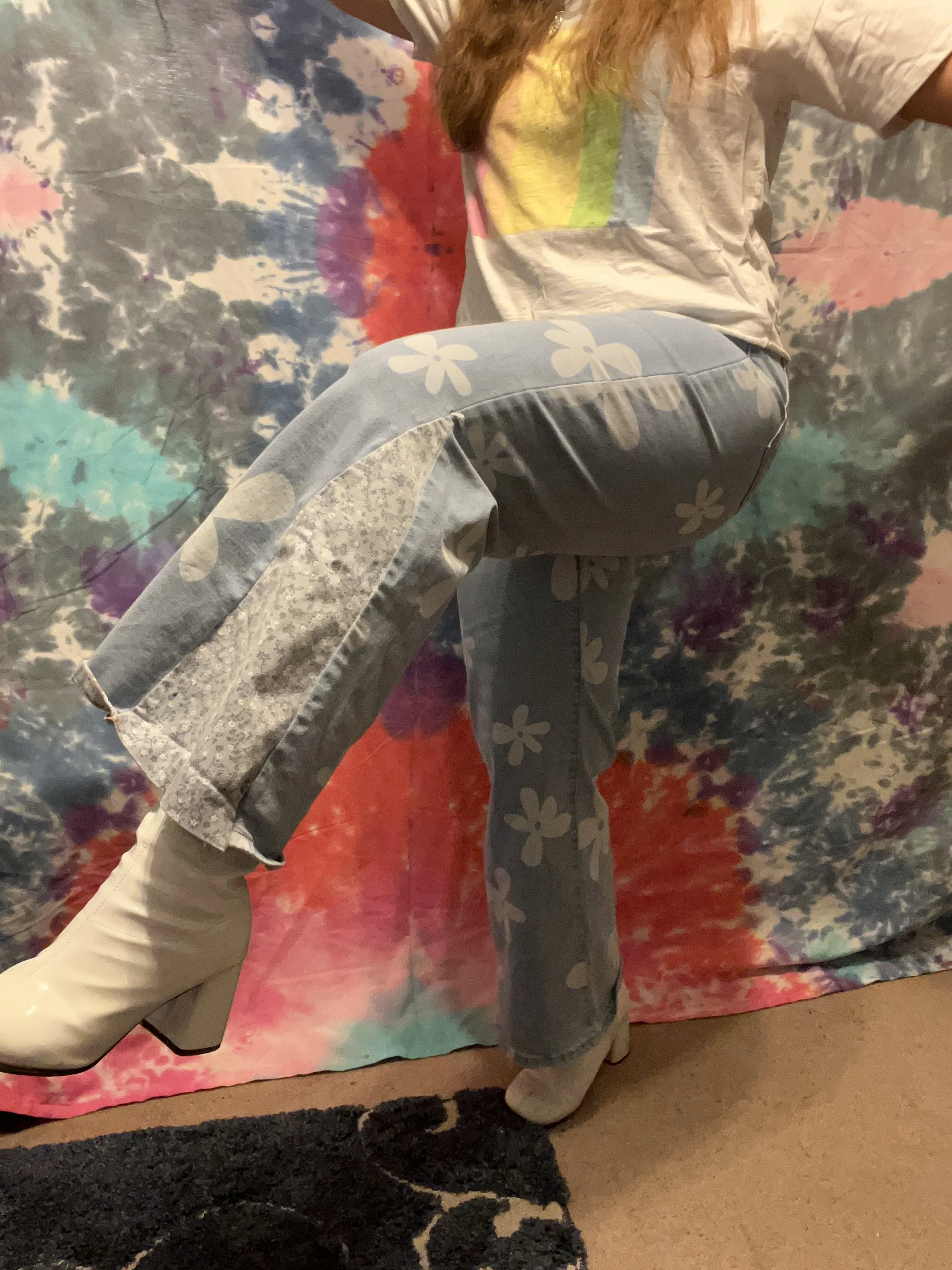 Flower printed denim bell-bottoms with light blue floral flare detail