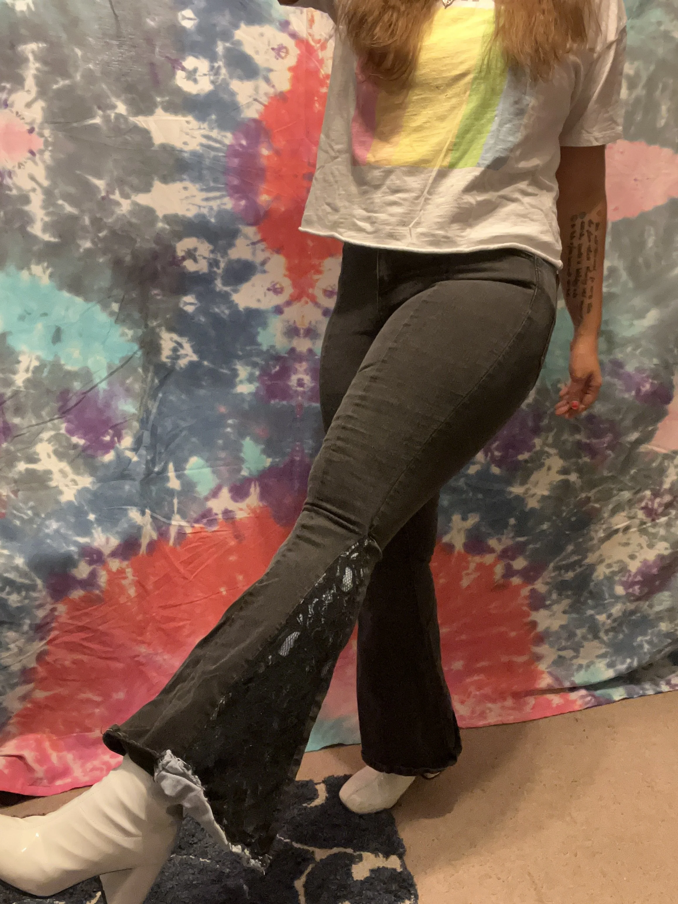 Black denim bell-bottoms with blue denim and black lace flare detail