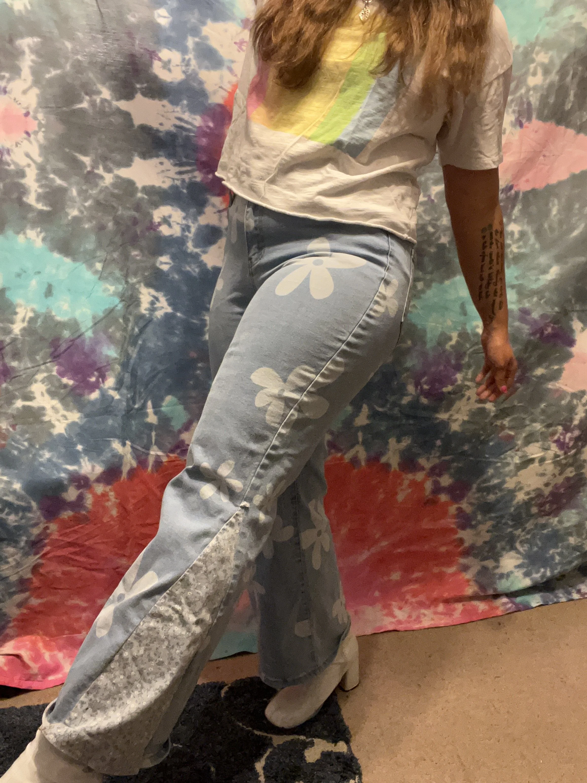 Flower printed denim bell-bottoms with light blue floral flare detail