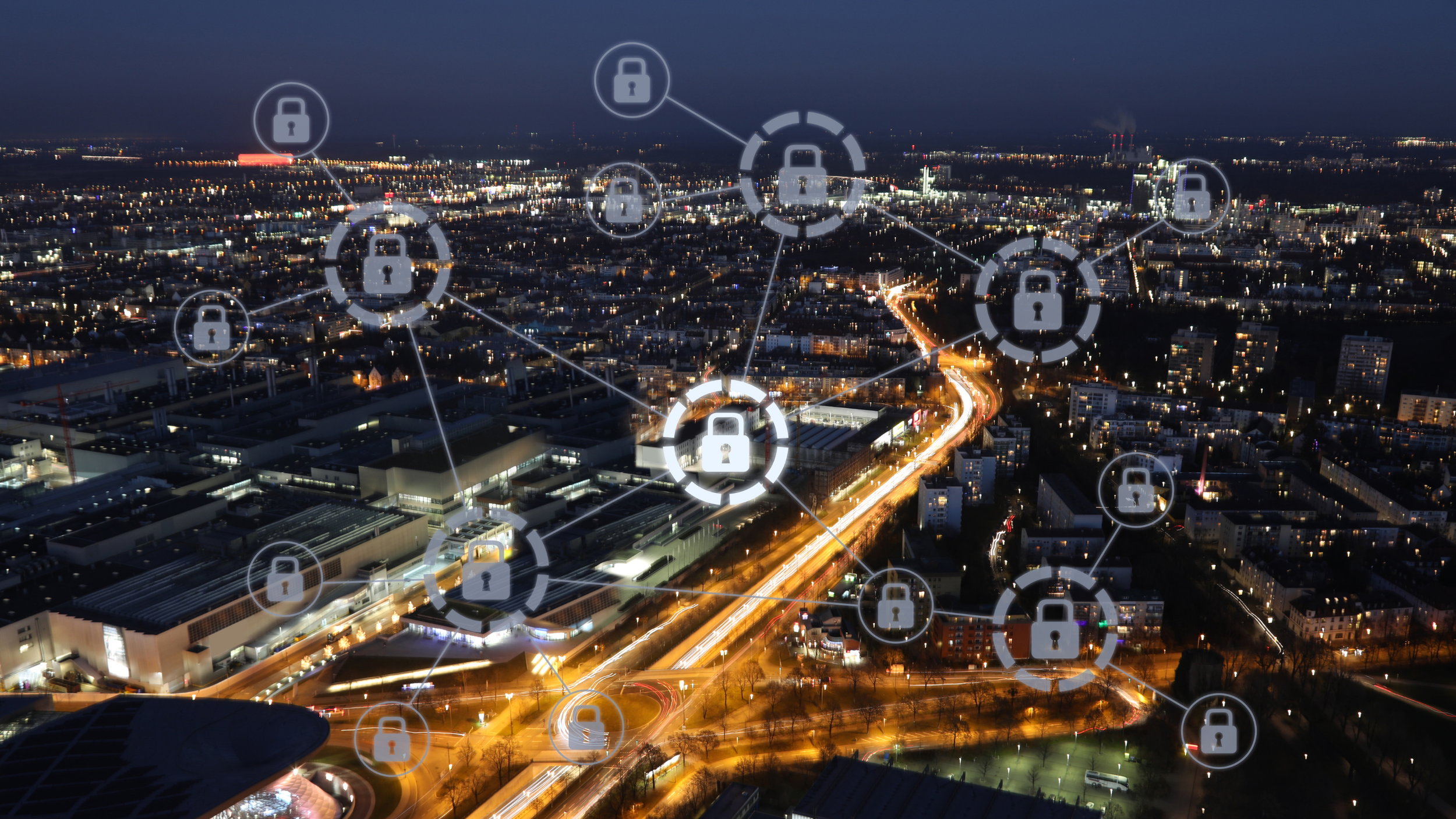 Night cityscape with digital lock icons connected by lines representing cybersecurity or data protection.