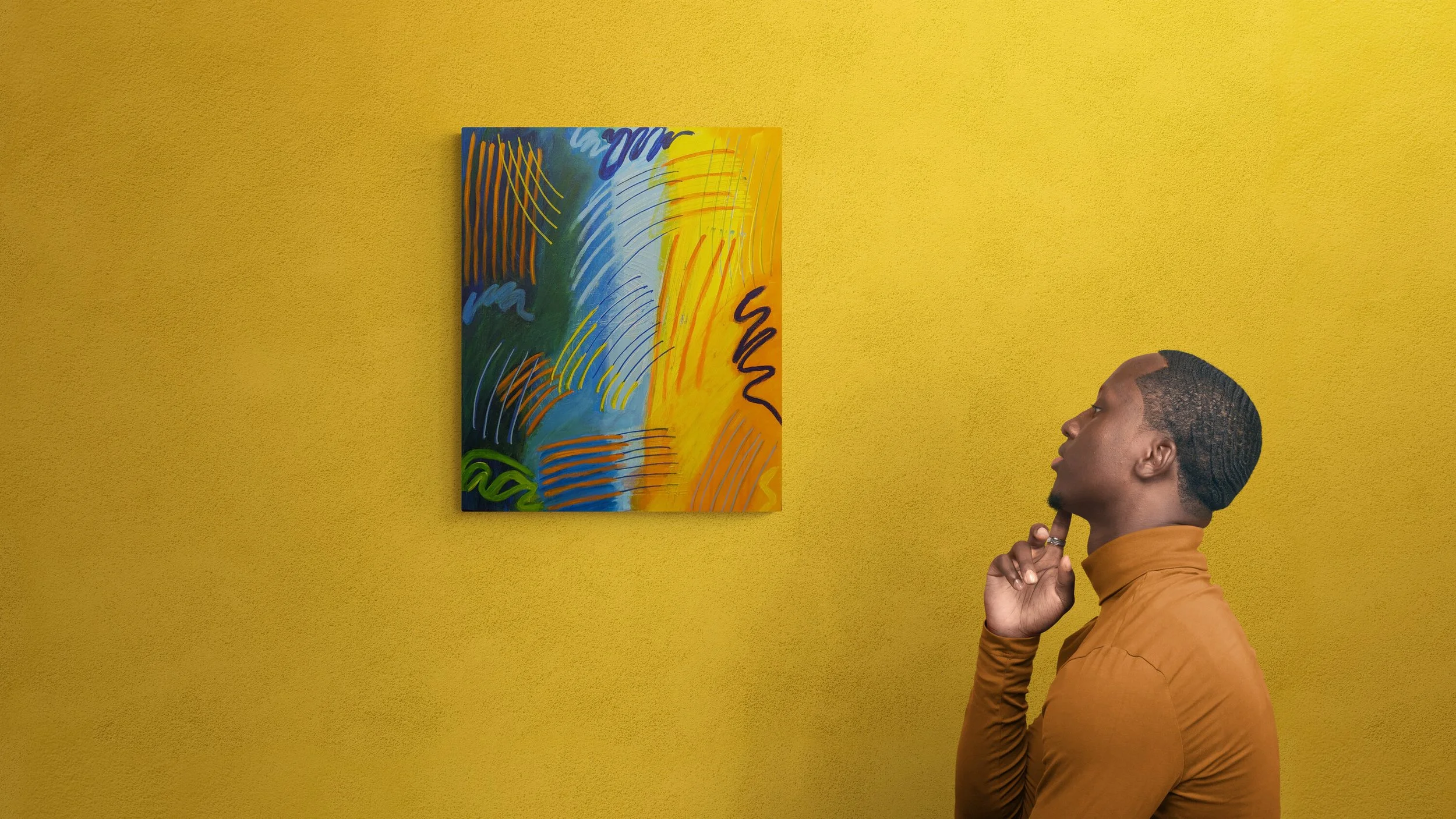 young-man-next-to-gallery-wall.jpg