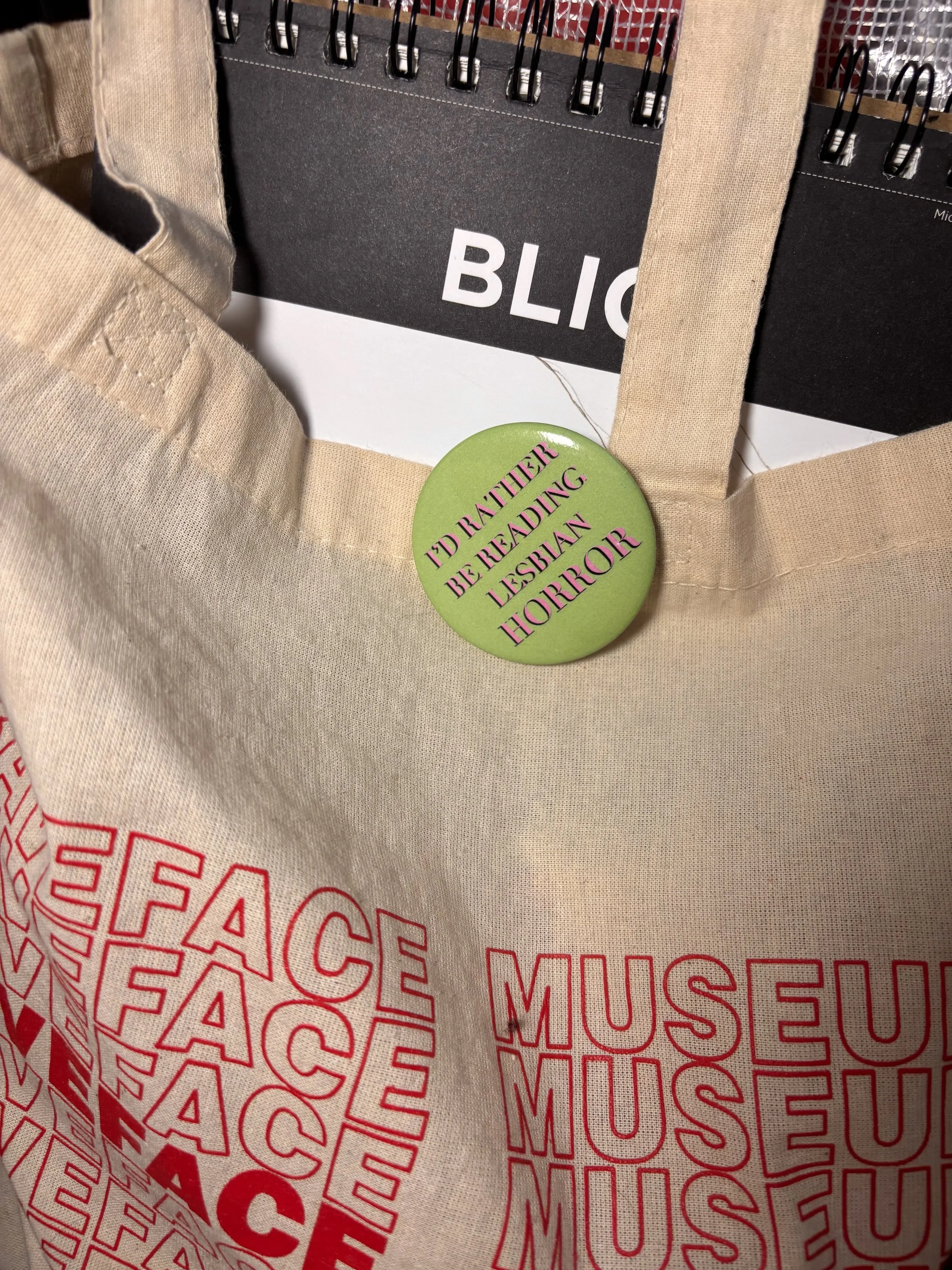 lesbian horror; horror books; I'd rather be reading lesbian horror; I'd rather be reading lesbian things button pin; horror movies; Nomad Nirvana Books; merch