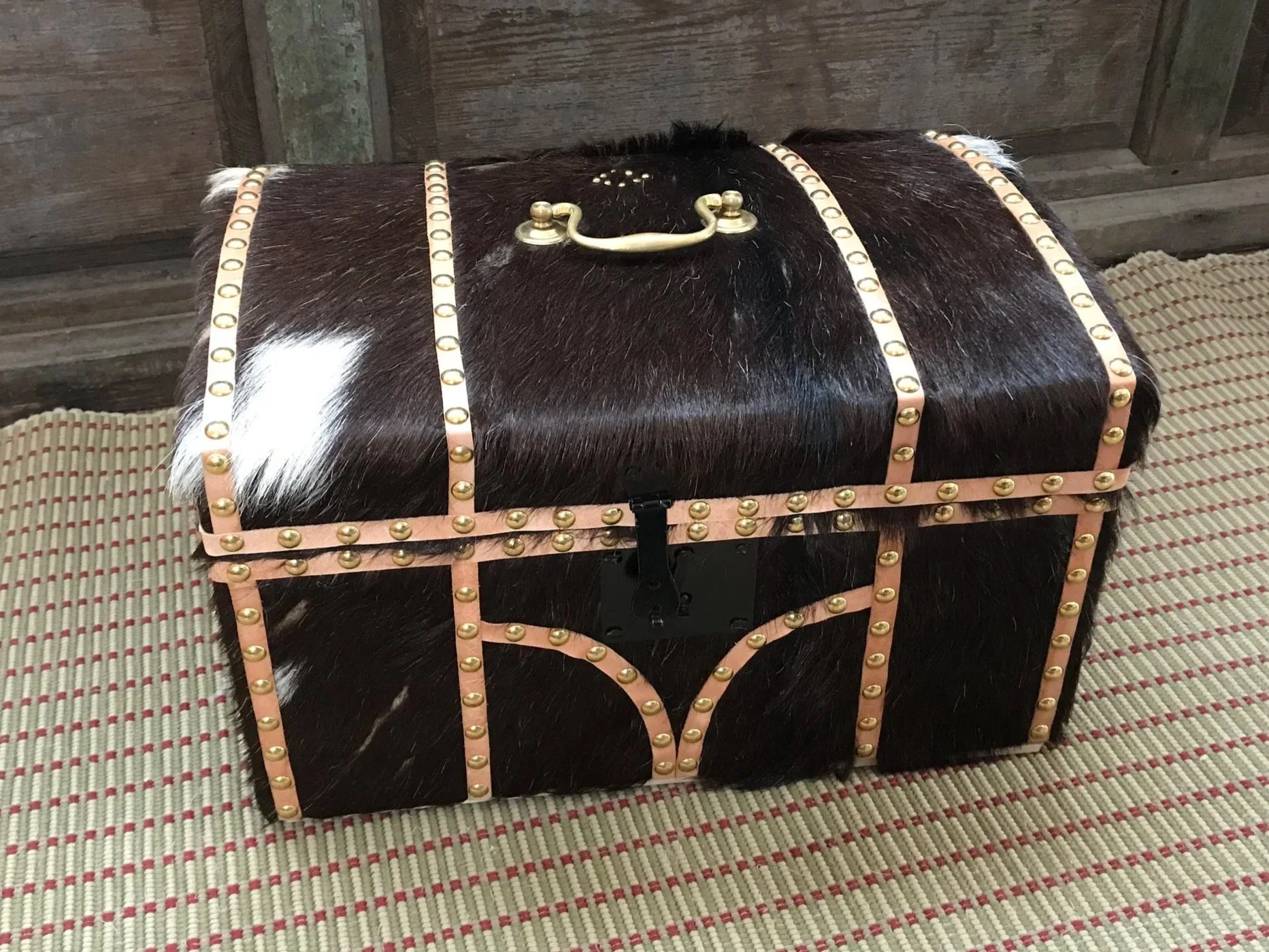 A small hide trunk, of document box size