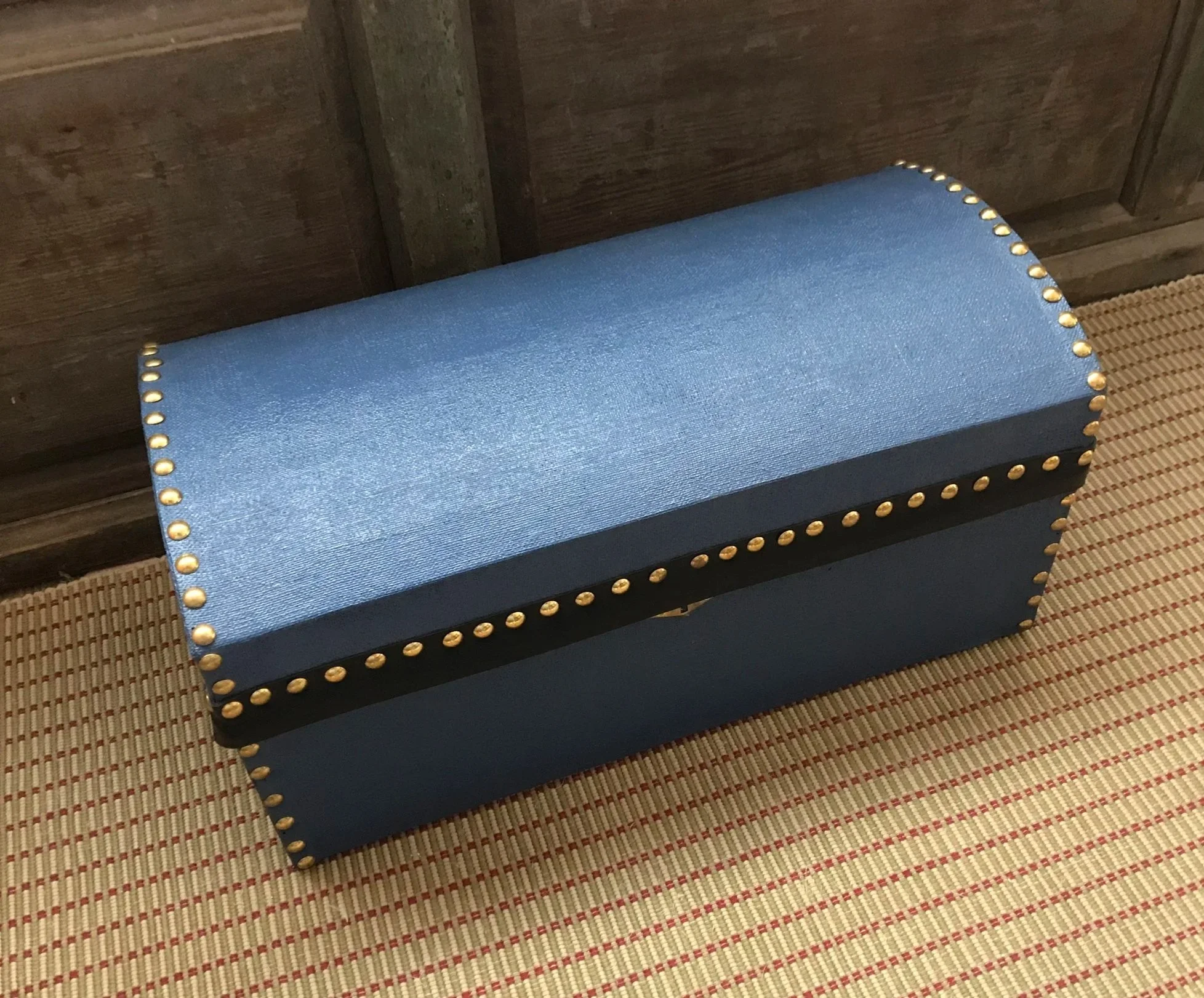 A painted canvas trunk awaiting the initials of its owner. The lock is a half mortise one. Its use was not typical on trunks in the century, but did exist.