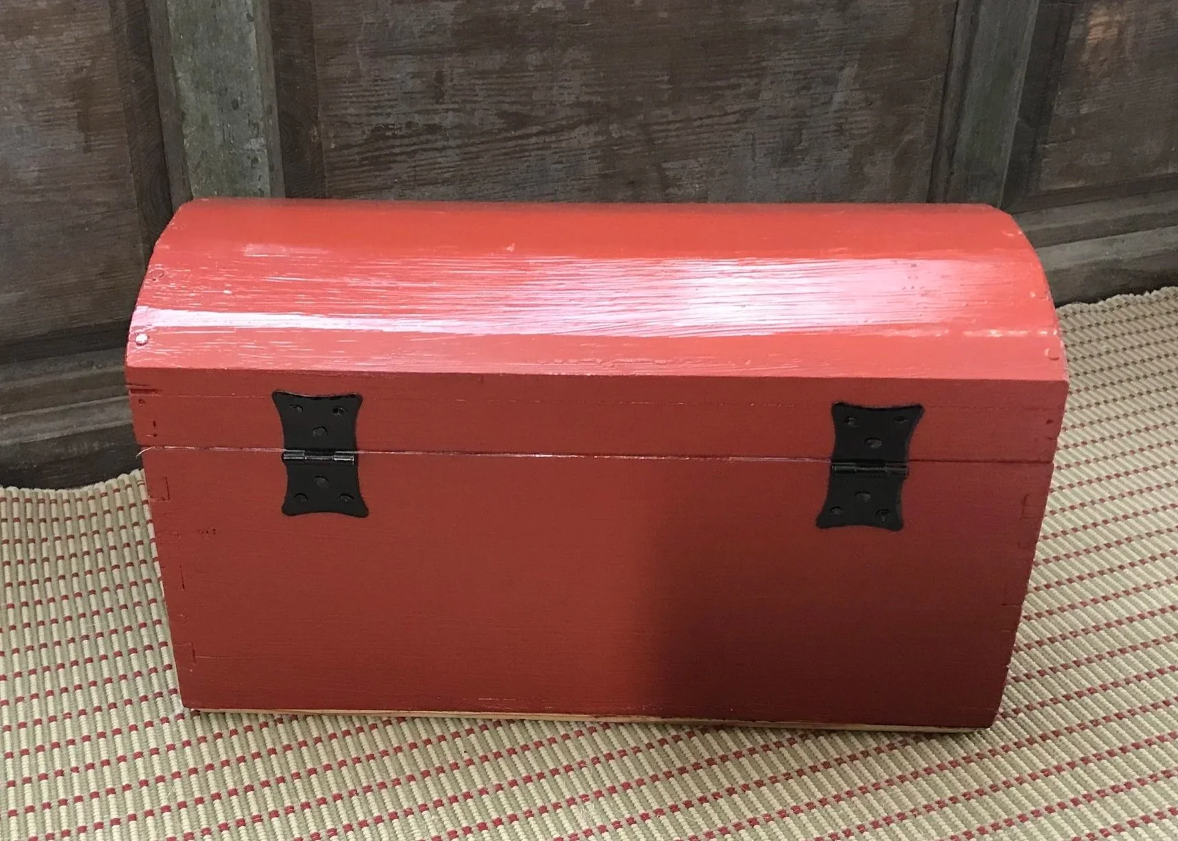 The hinges are mounted with clenched nails for security and durability.