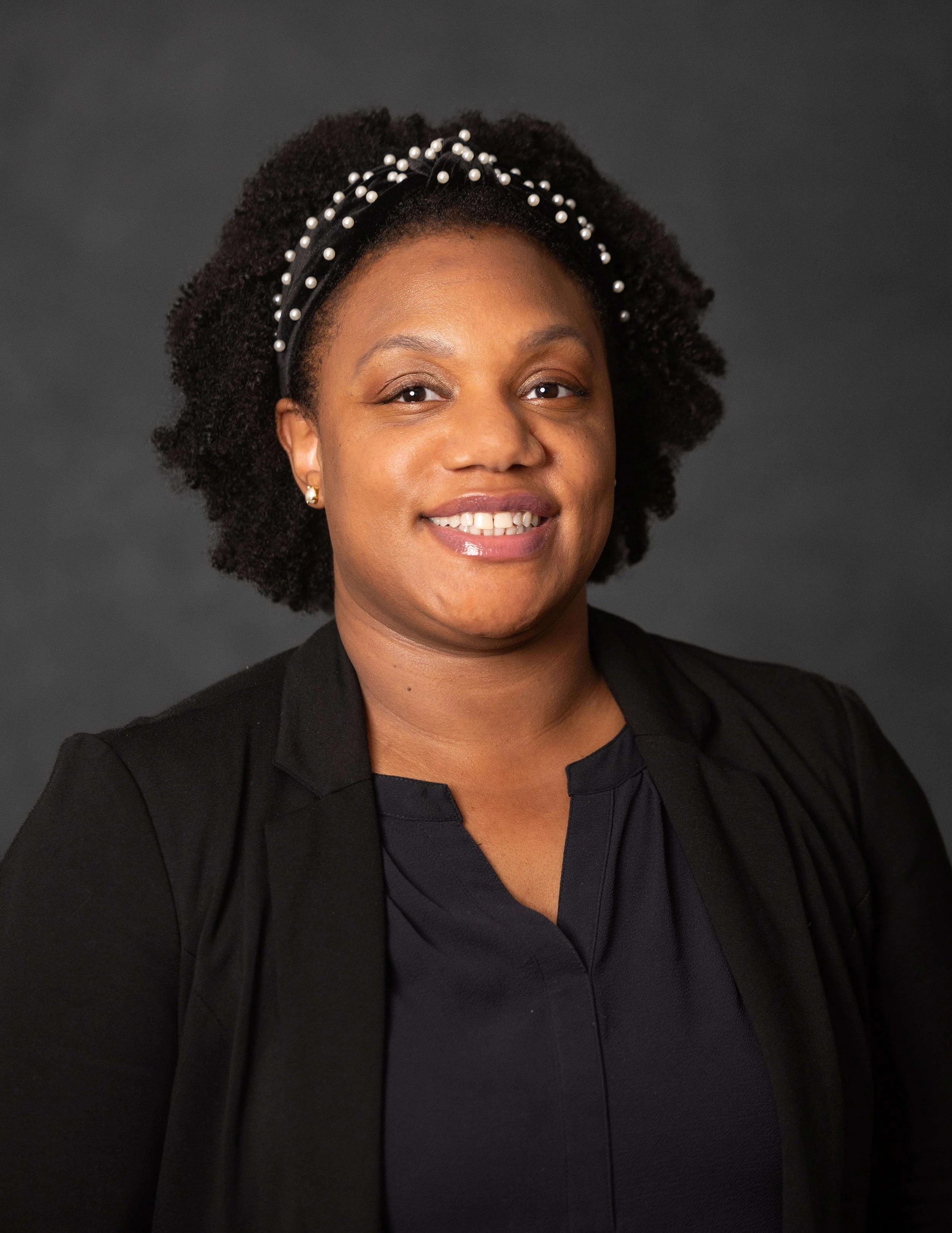 Professional headshot of Andrea Jackson, a licensed therapist providing therapy for young adults and women in Washington DC and online.