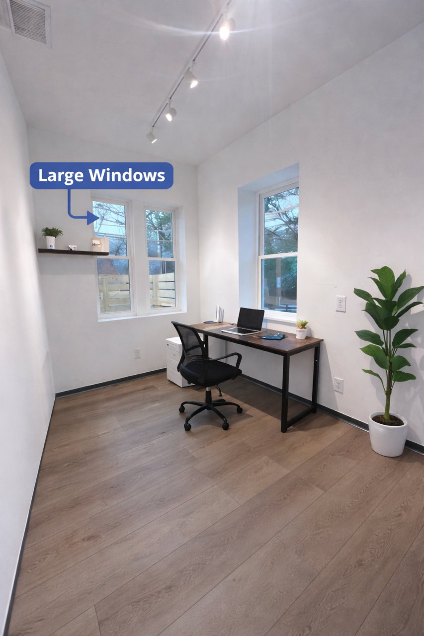 Interior of a hair salon with two oval mirrors, a wooden shelf with cords, and a neon sign on the wall reading 'You're like really pretty.'