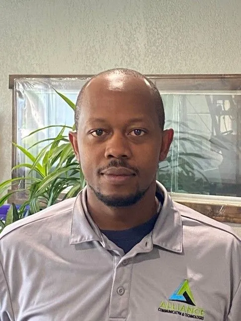Headshot of Tim Ahumuza, Operations Manager of Alliance Communication & Technologies