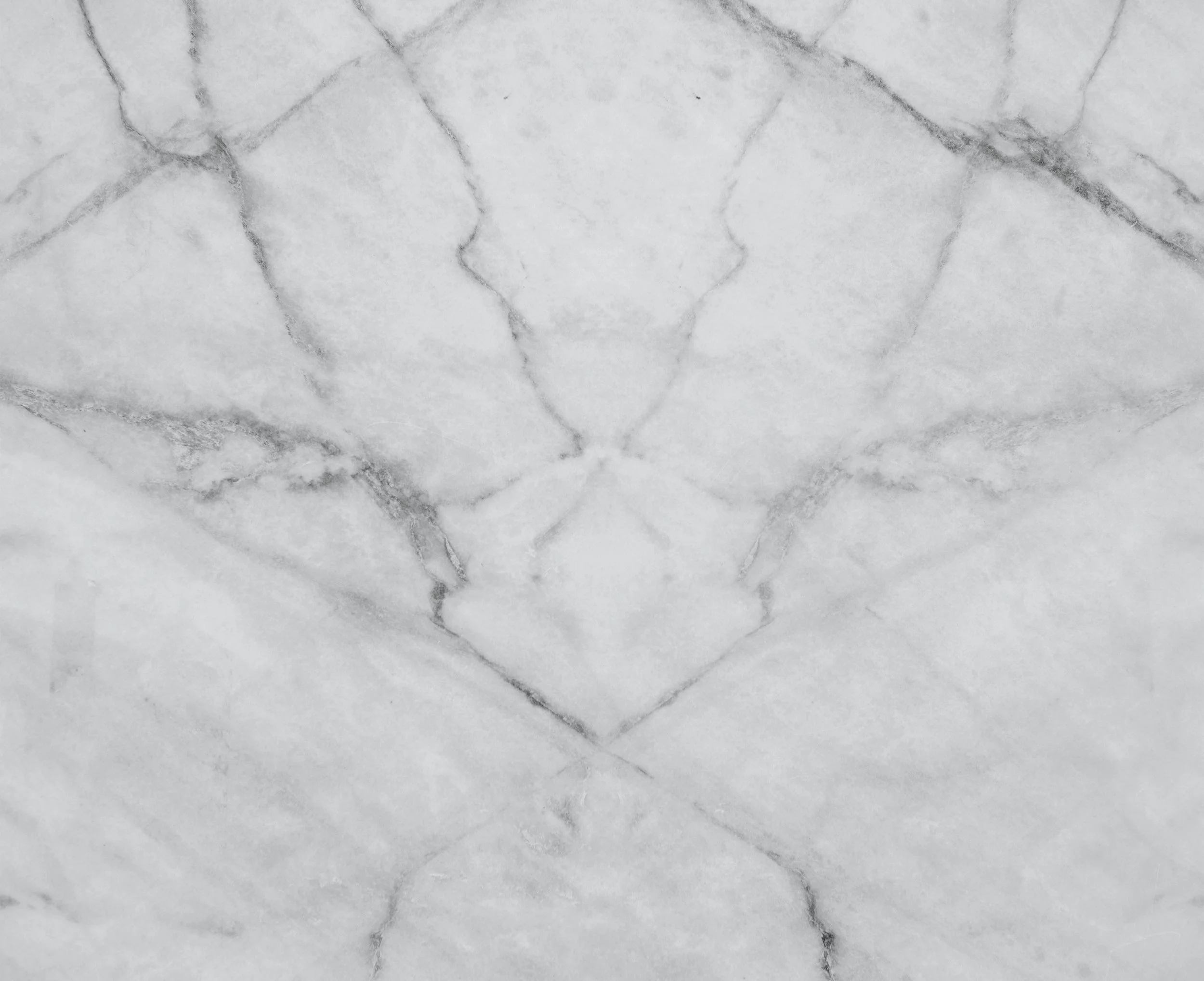 Close-up of white marble surface with gray veining.