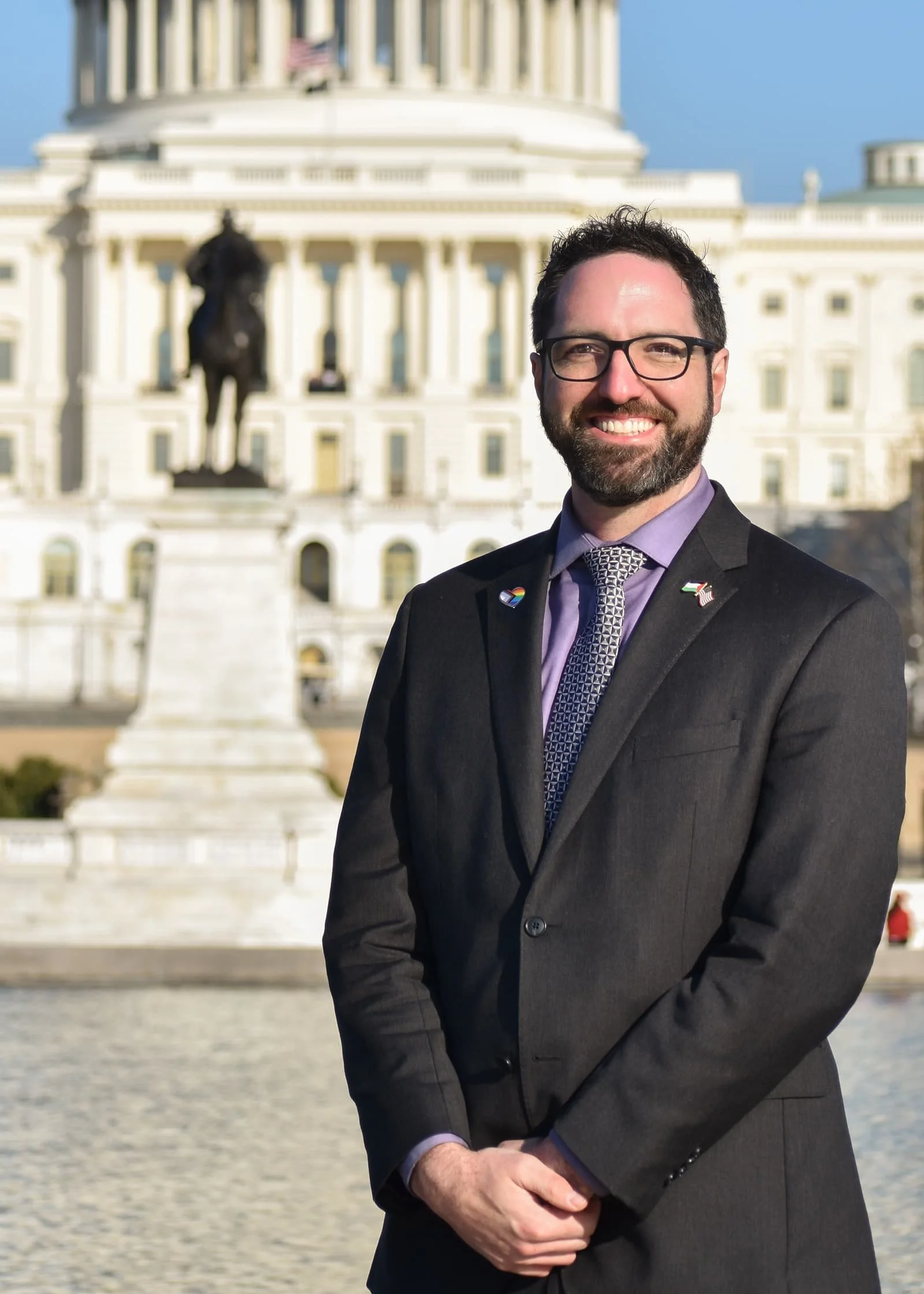 Andrew Rice in front of the U.S. Capitol building.