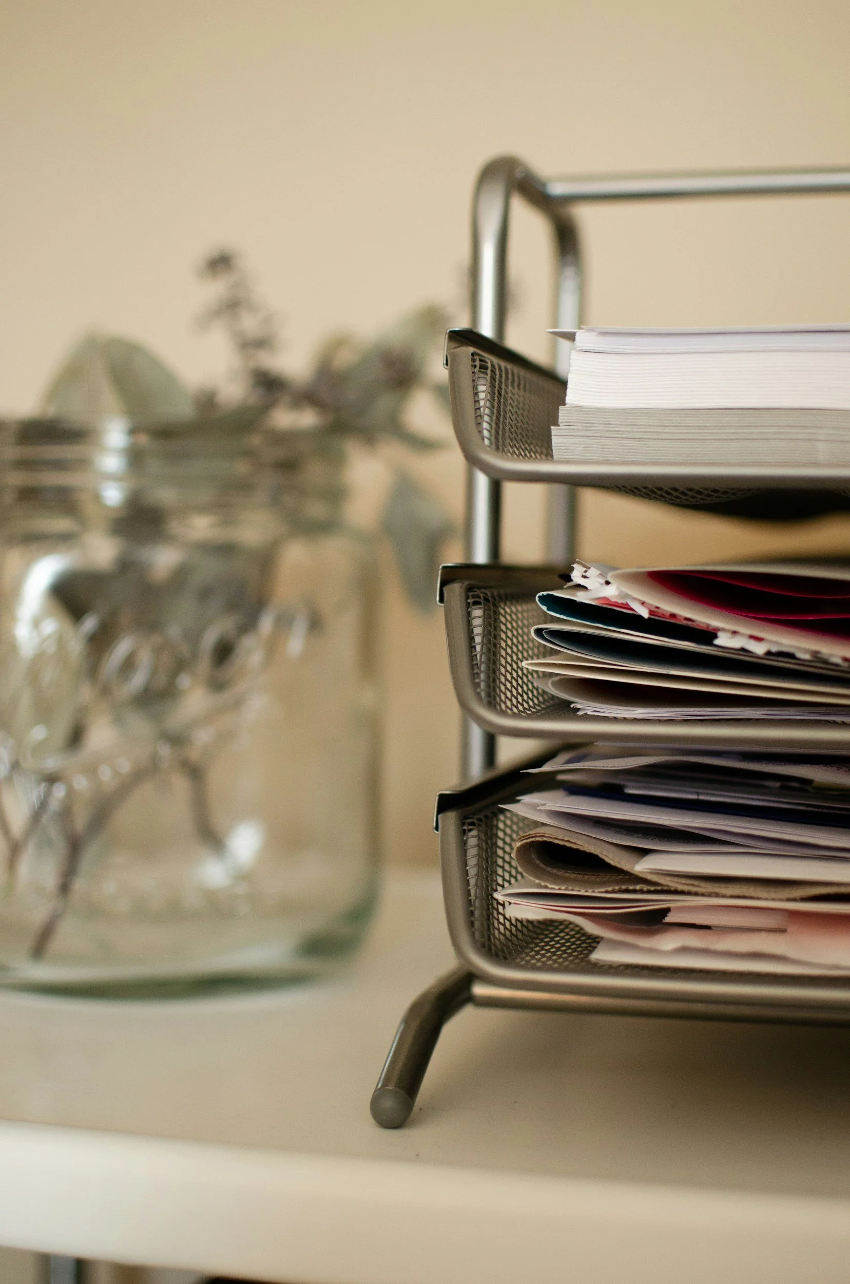A metal stacking tray with files