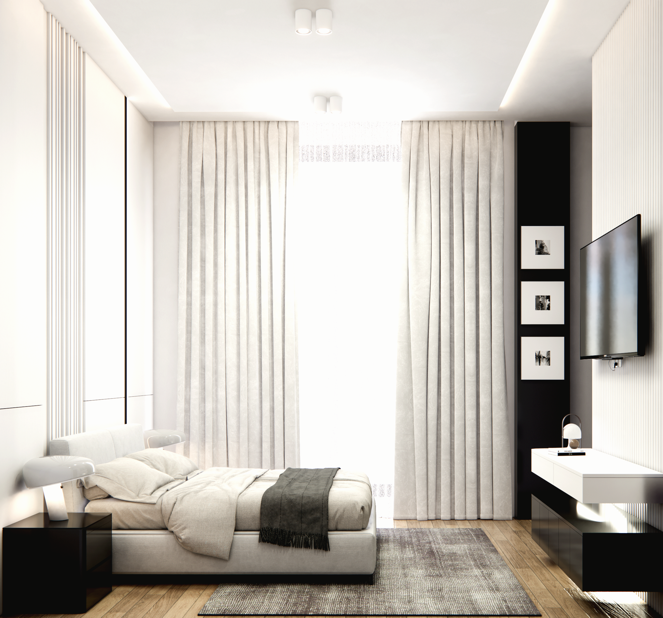 A beige sofa with decorative pillows and a glass coffee table with a vase of white and green flowers in a living room with patterned curtains.