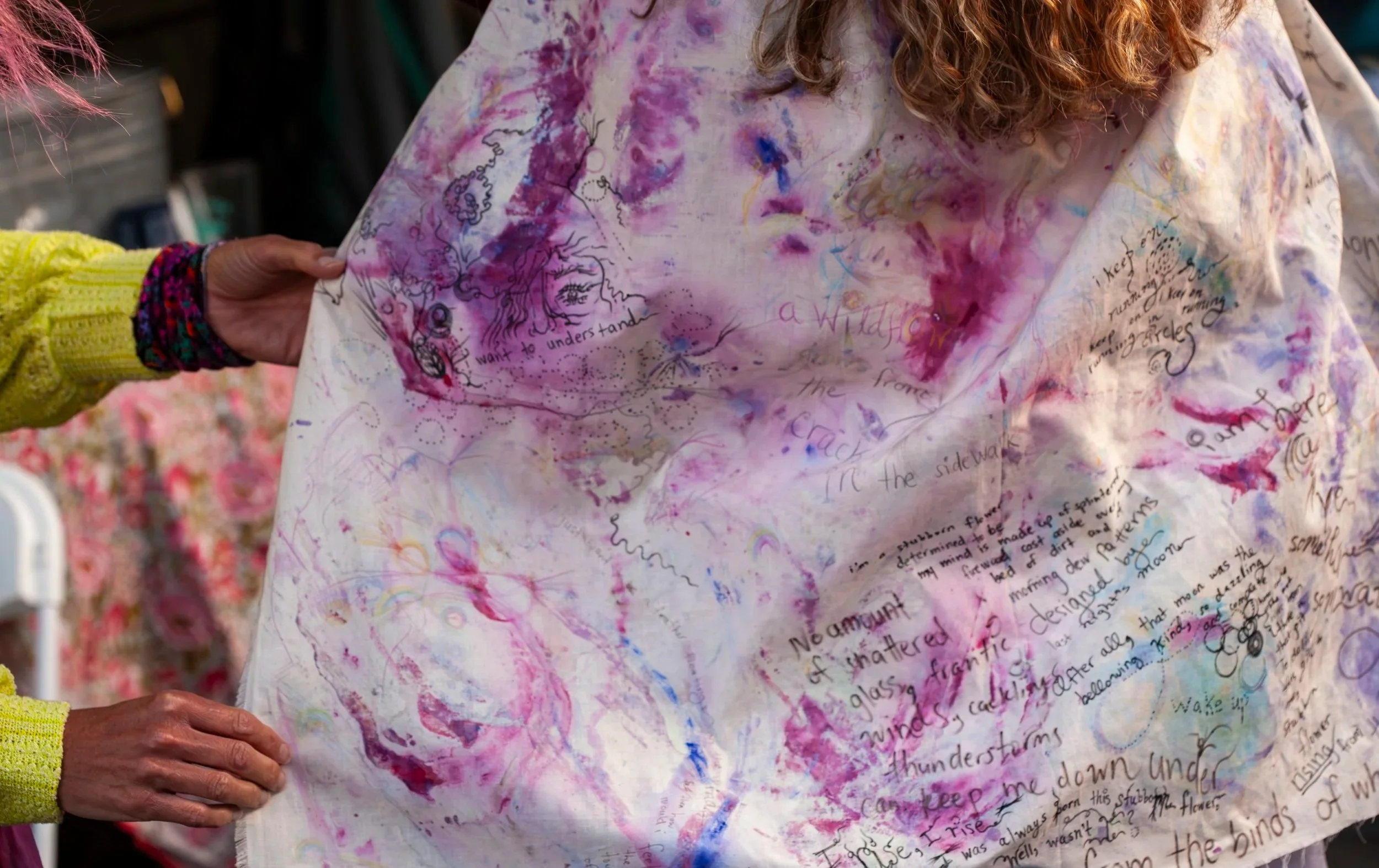 photo of Nicole Javorsky wearing a cape she made at a performance of her new album in 2025