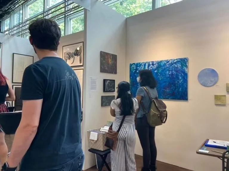 image of visitors to Nicole Javorsky's booth at the Other Art Fair by Saatchi Art