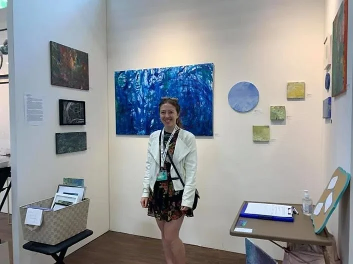 image of artist Nicole Javorsky outside of her booth at The Other Art Fair in Brooklyn presented by Saatchi Art