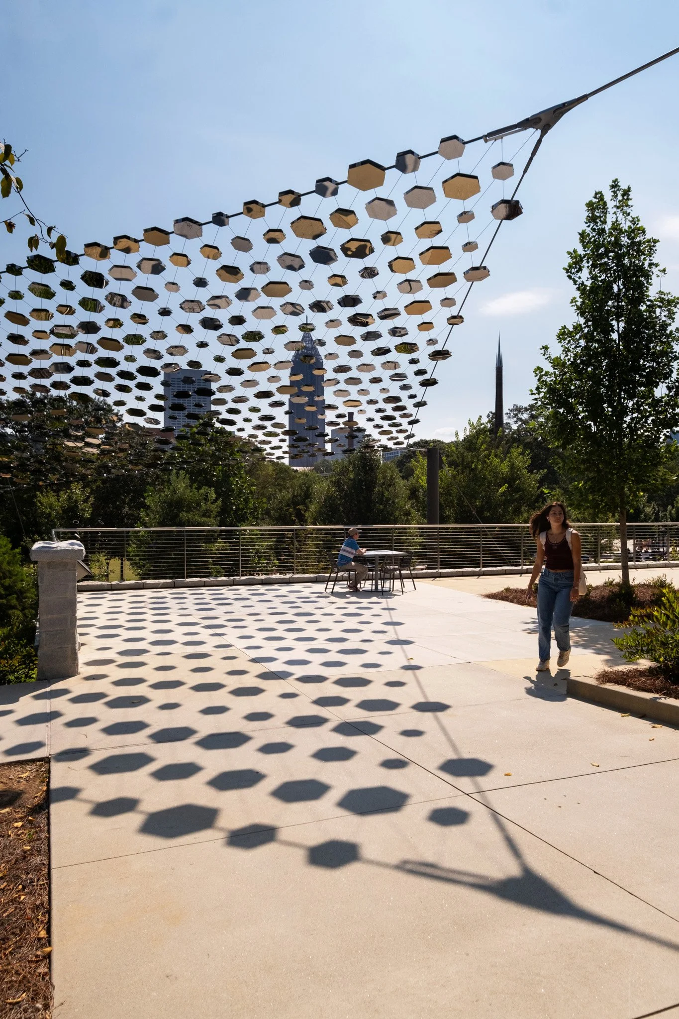 Pathway of Progress canopy installed at Georgia Tech by Bespoke Wire & Rope with hamma Architectural Inc, featuring stainless steel cables, cross clamps, and mirror-polished artwork panels.