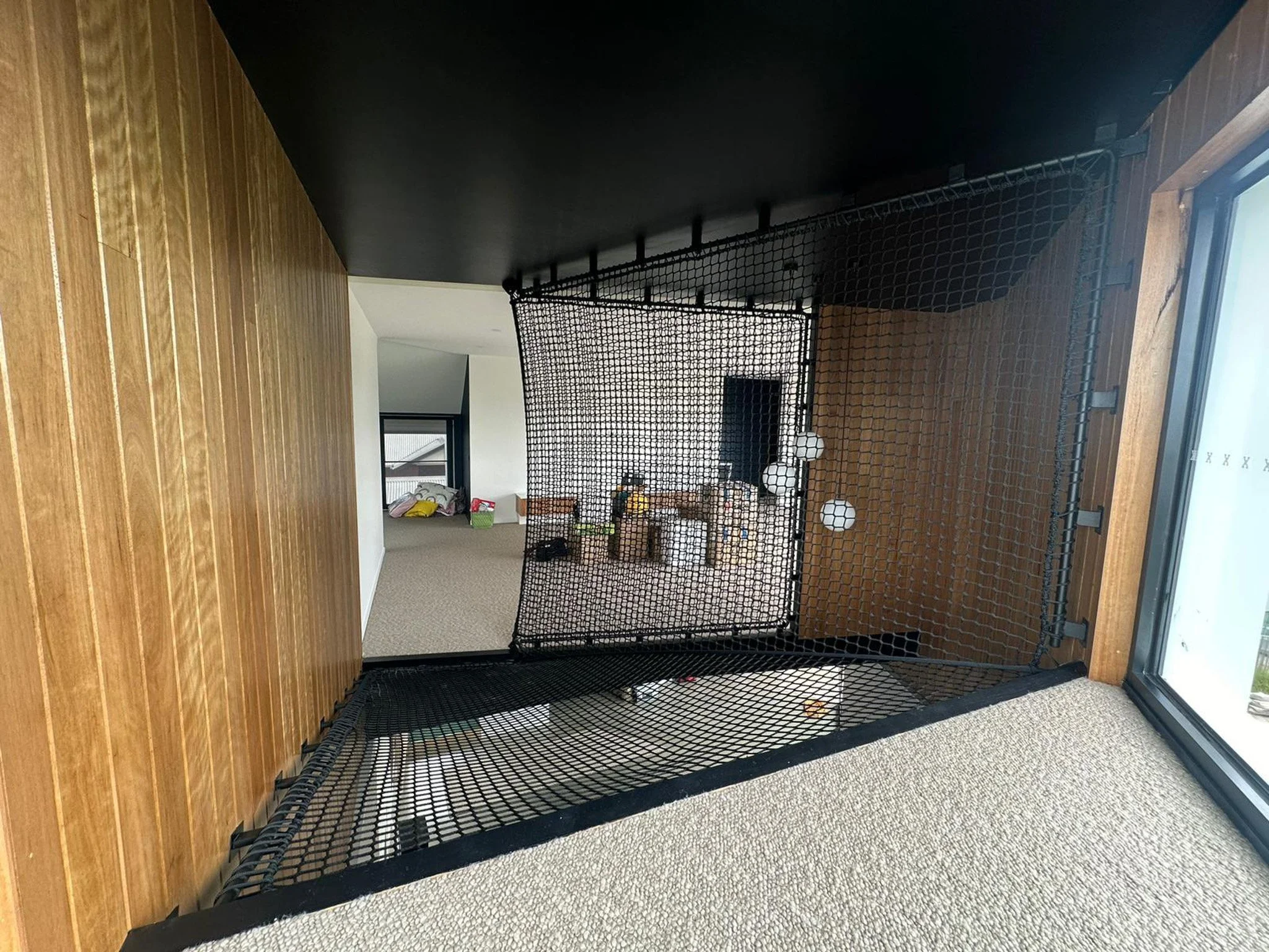 Trafficable loft net in Drumcondra VIC designed and installed by Bespoke Wire & Rope with Linked Building. Multi-use net acting as hammock, balustrade, and bridge to a lookout lounge.