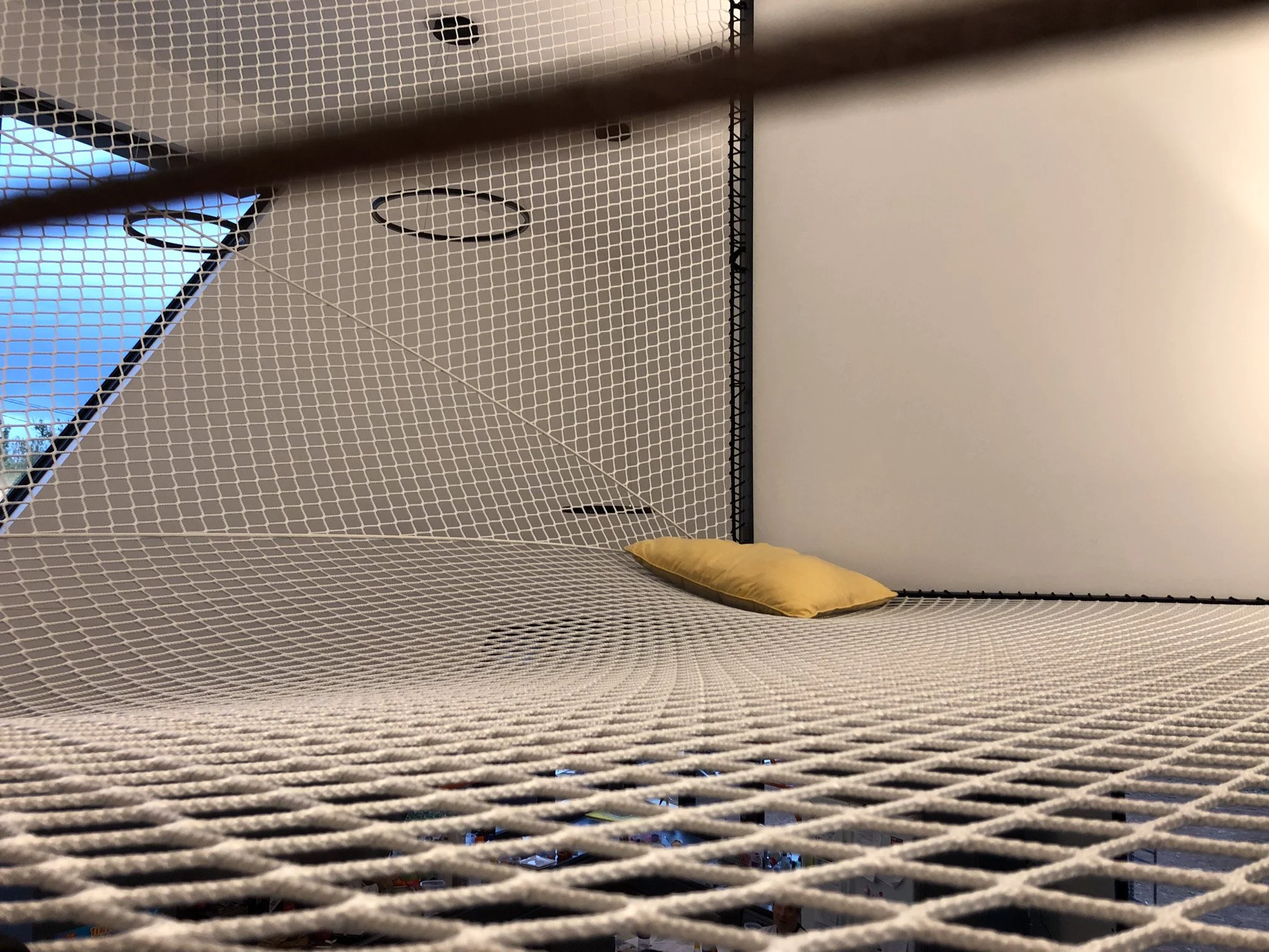 Geometric walk-on net installed in a Dickson ACT residence by Bespoke Wire & Rope. Custom L-shaped design templated and installed in stages to create a unique family relaxation space.