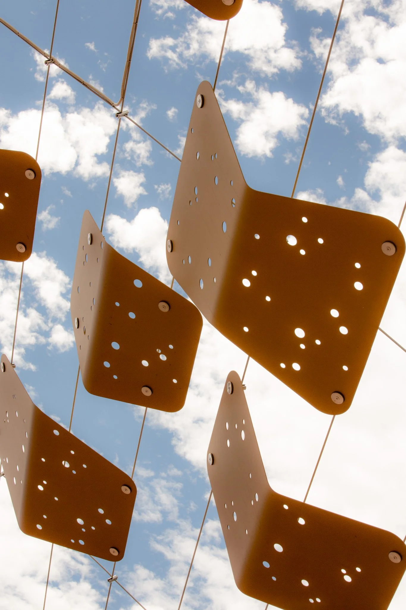 Bespoke Wire & Rope staff contributed to the Perth Stadium Arbour Walkway installation, a large-scale tensile cable project featuring 3,000 artwork tiles that tell Aboriginal stories through their unique placement.