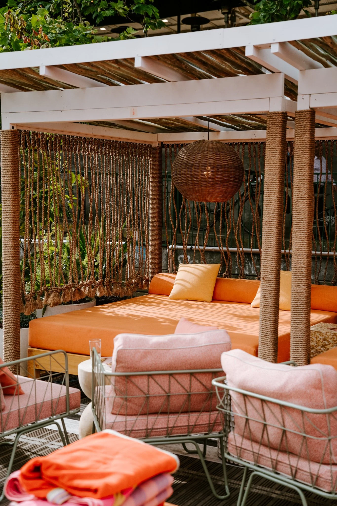 Decorative manilla rope installations by Bespoke Wire & Rope for Arbory Afloat Melbourne VIC, including ceiling-hung dividers, wrapped cabana columns, and suspended pool feature.