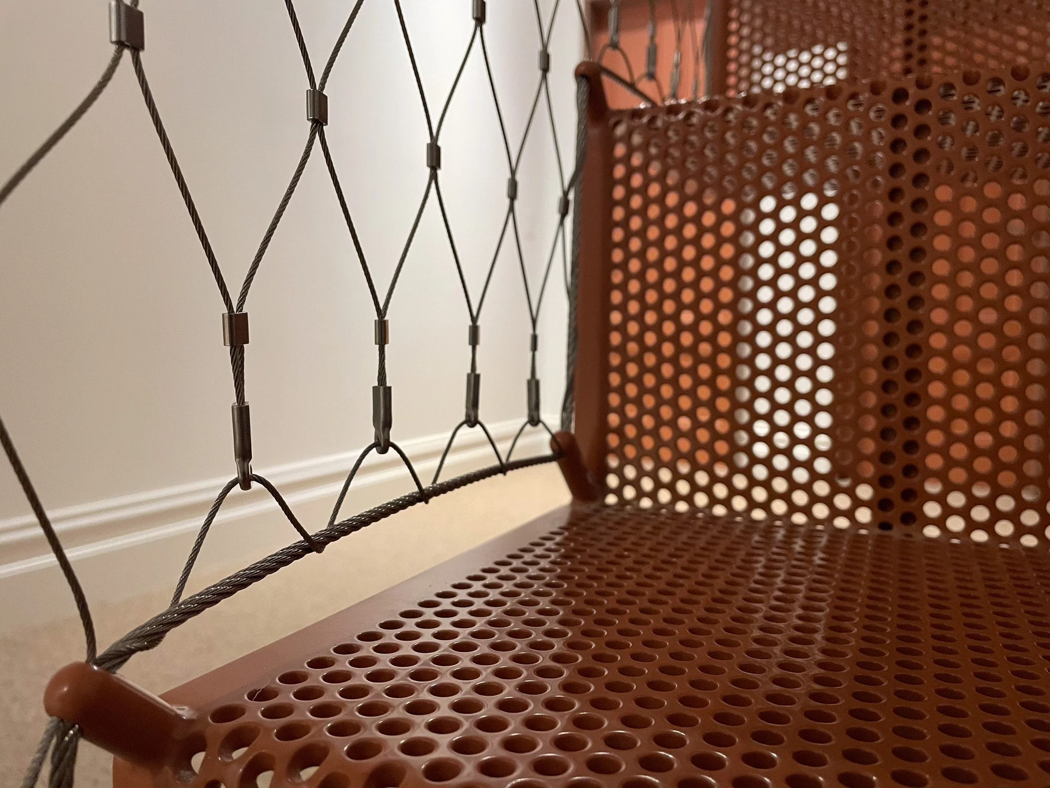 Custom stair mesh balustrade installed by Bespoke Wire & Rope in Hawthorn VIC with Basis Builders, Wowowa Architects, and Star Sheetmetal.