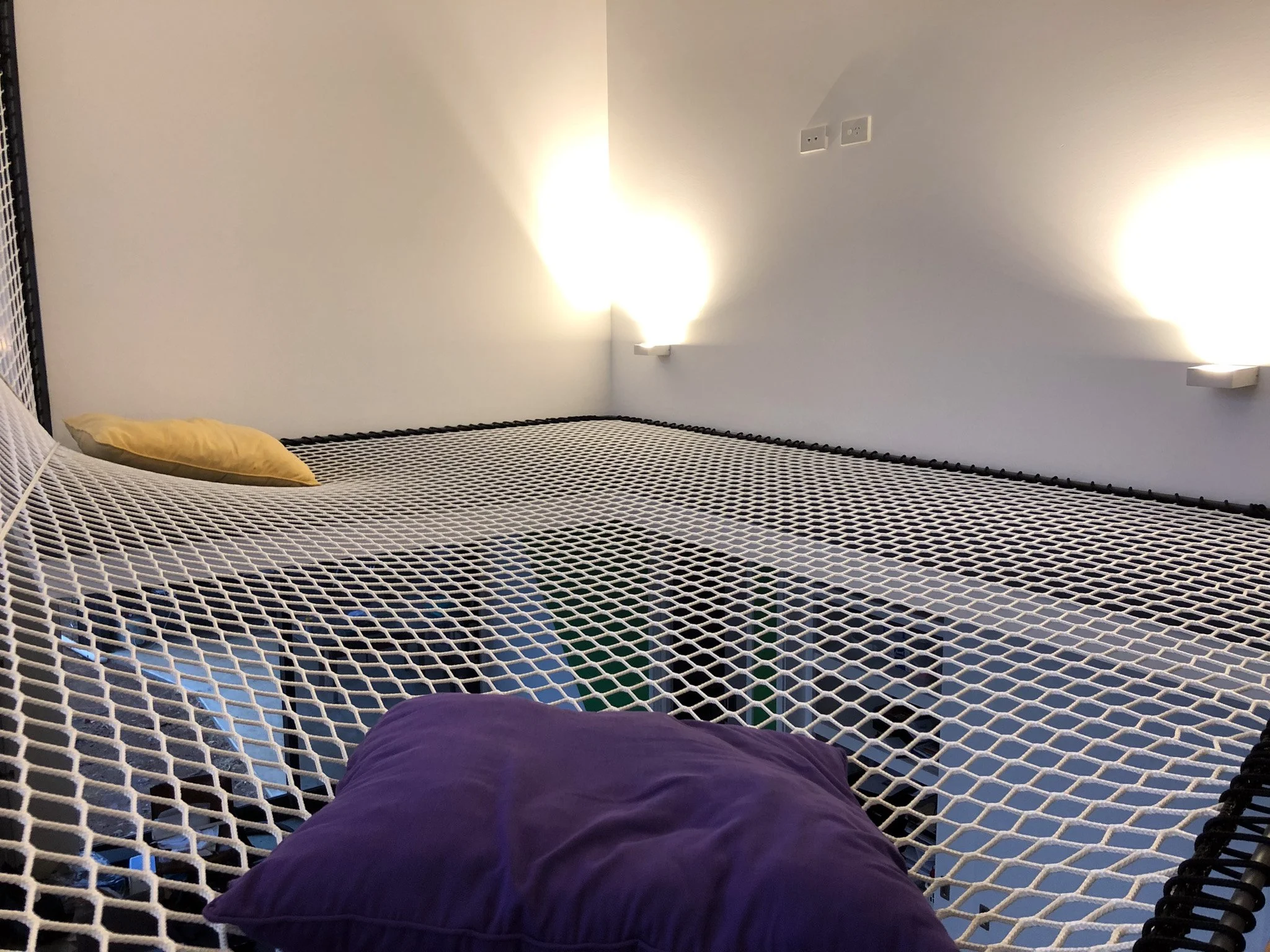 Geometric walk-on net installed in a Dickson ACT residence by Bespoke Wire & Rope. Custom L-shaped design templated and installed in stages to create a unique family relaxation space.