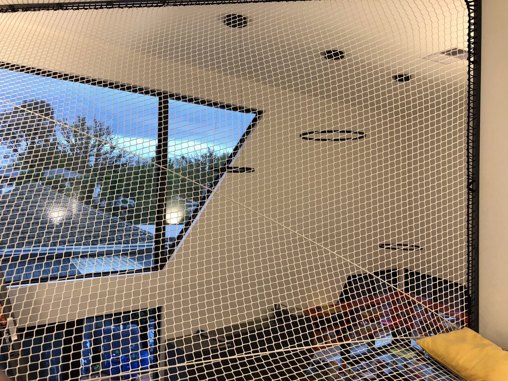 Geometric walk-on net installed in a Dickson ACT residence by Bespoke Wire & Rope. Custom L-shaped design templated and installed in stages to create a unique family relaxation space.