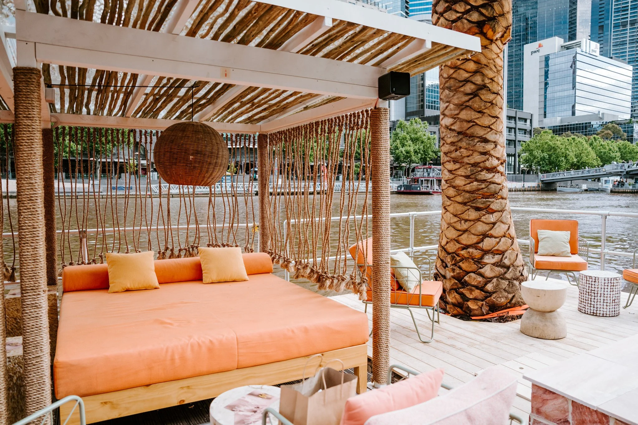 Decorative manilla rope installations by Bespoke Wire & Rope for Arbory Afloat Melbourne VIC, including ceiling-hung dividers, wrapped cabana columns, and suspended pool feature.