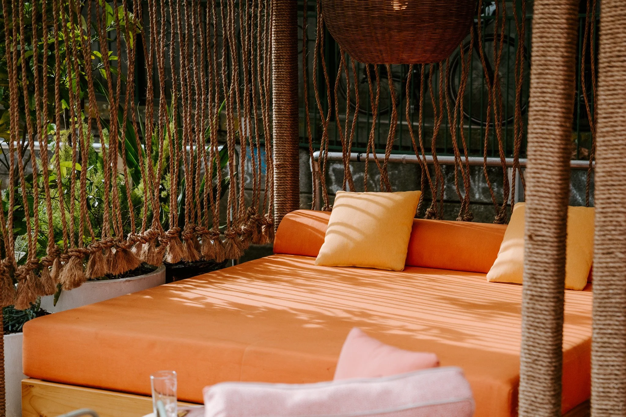 Decorative manilla rope installations by Bespoke Wire & Rope for Arbory Afloat Melbourne VIC, including ceiling-hung dividers, wrapped cabana columns, and suspended pool feature.