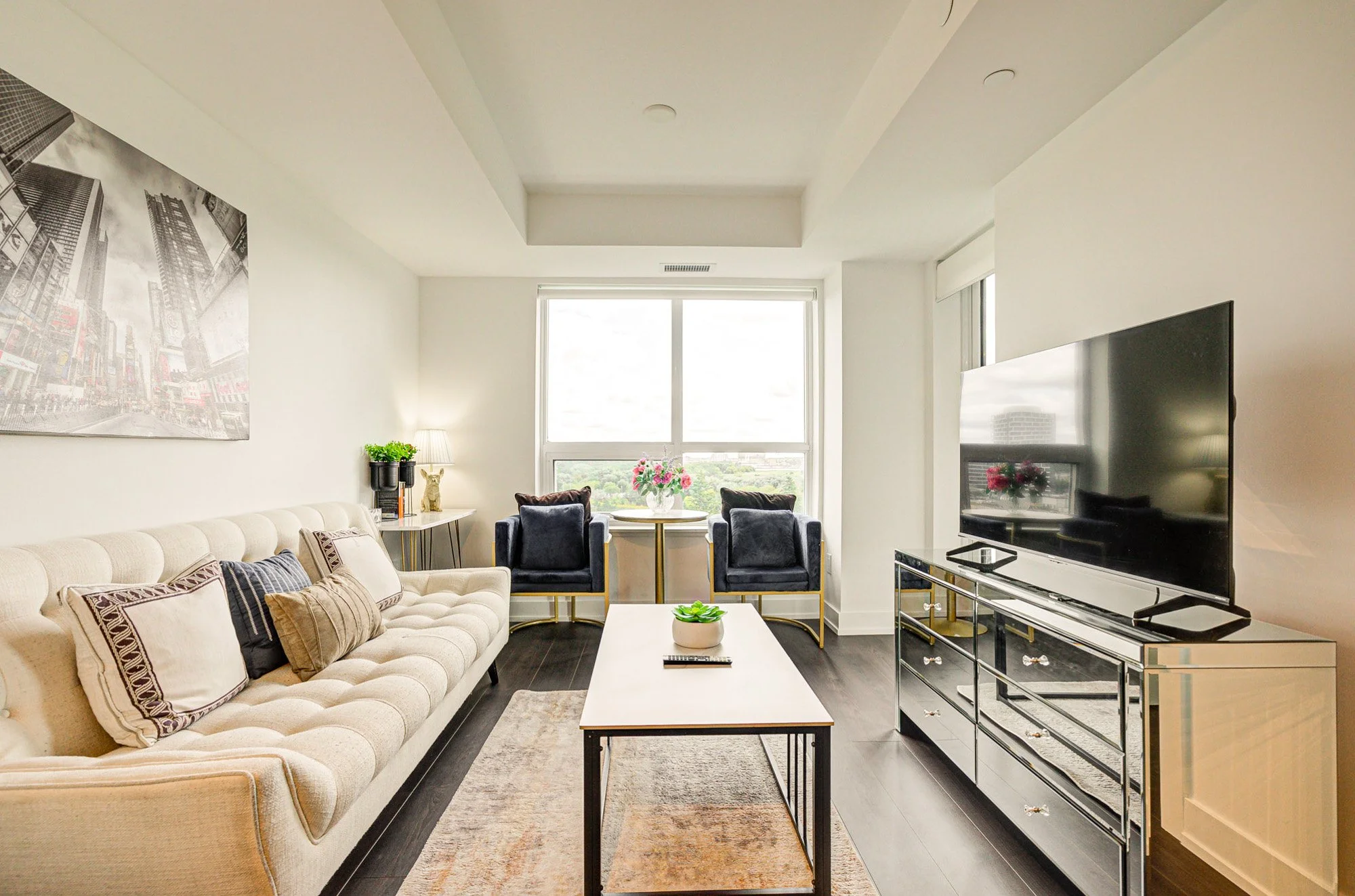 A close-up of an adult's hand gently holding a tiny baby's foot.