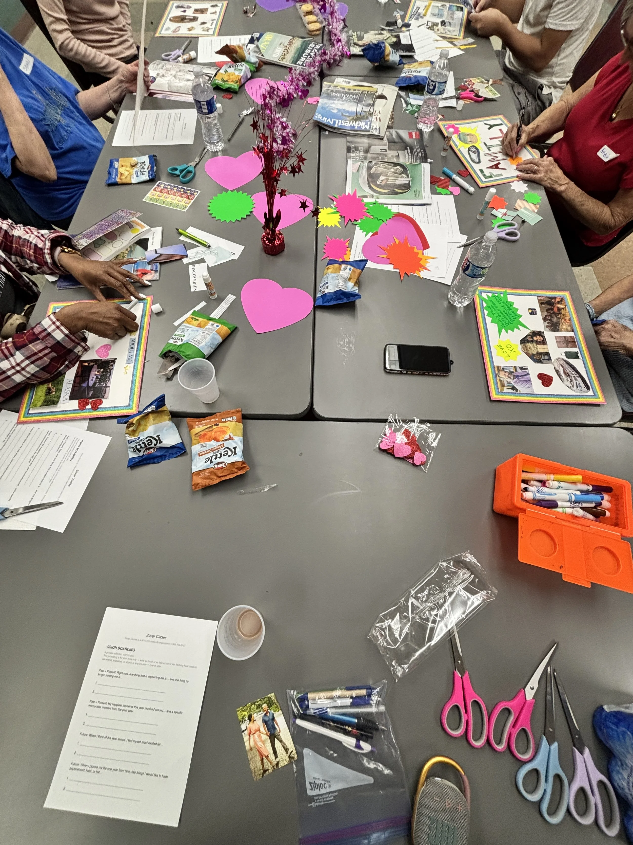 We organized a warm, creative vision‑board gathering where everyone came together to reflect, craft, and share meaningful moments. The table full of photos, colors, and reflection prompts shows how the group connected through storytelling, intention‑