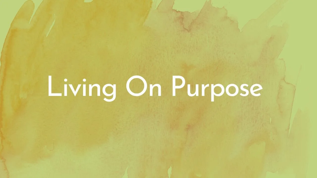 Text on yellow watercolor background that reads "Living On Purpose"