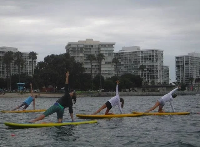 June 2015 - modified side plank during SUP yoga at the yoga journal conference in San Diego
