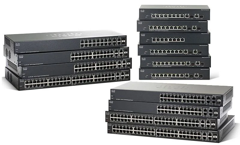 Multiple Cisco network switches stacked and arranged, used for data networking.