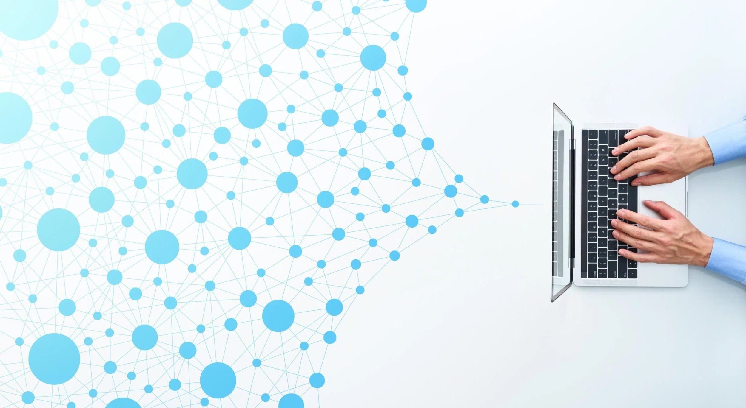 A person wearing a blue shirt typing on a laptop with a digital network and nodes graphic on the left side.