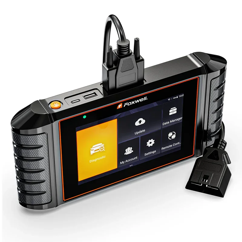 A handheld electronic diagnostic device with a touchscreen display, connected to a vehicle data cable, showing options like Diagnostic, Update, Data Manager, My Account, Settings, and Remote Control.
