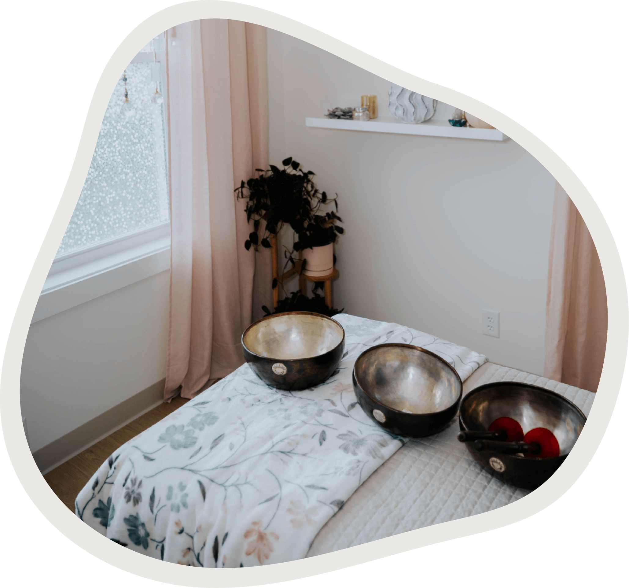 Massage Maven massage table with sound healing singing bowls in a calming treatment space.