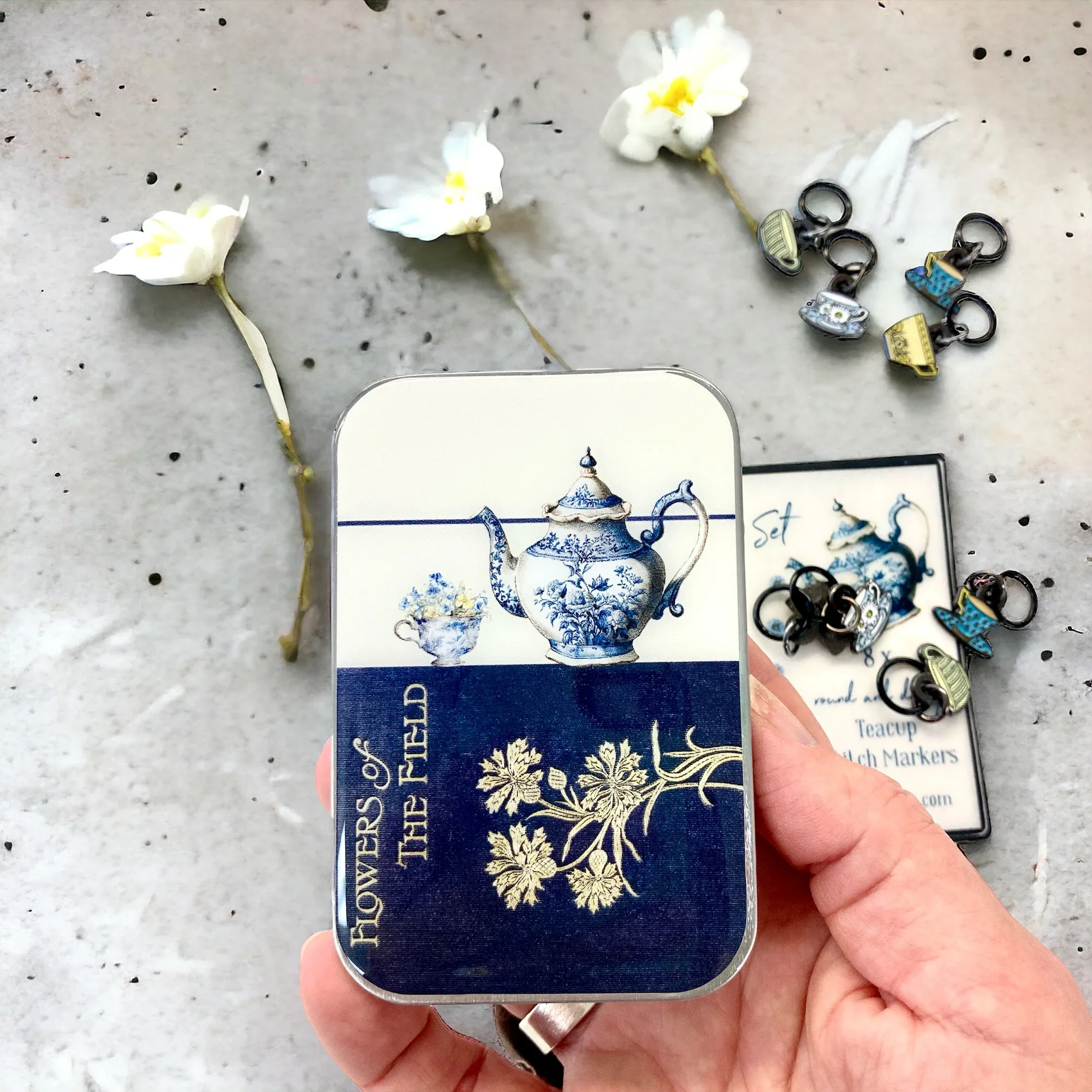 Tea Time Notions Tin by Firefly Notes featuring a vintage tea set collage on a handcrafted resin-topped sliding metal tin.