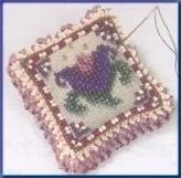 Mill Hill Cameo Tulip Beaded Pin Pillow Kit MHBPP5 featuring a dainty tulip design on linen with elegant beadwork.