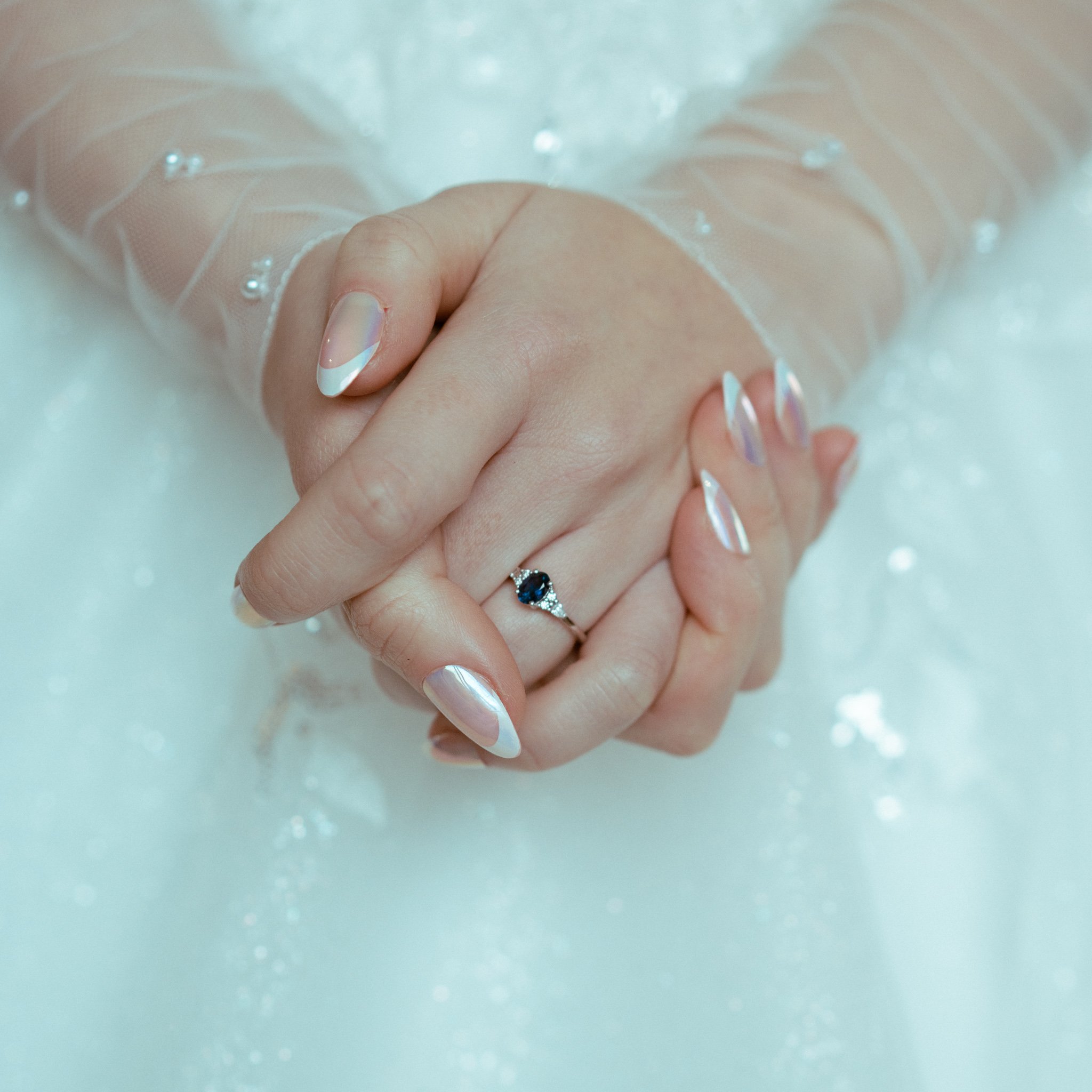frozen-inspired-wedding-dress-sapphire-ring.jpg