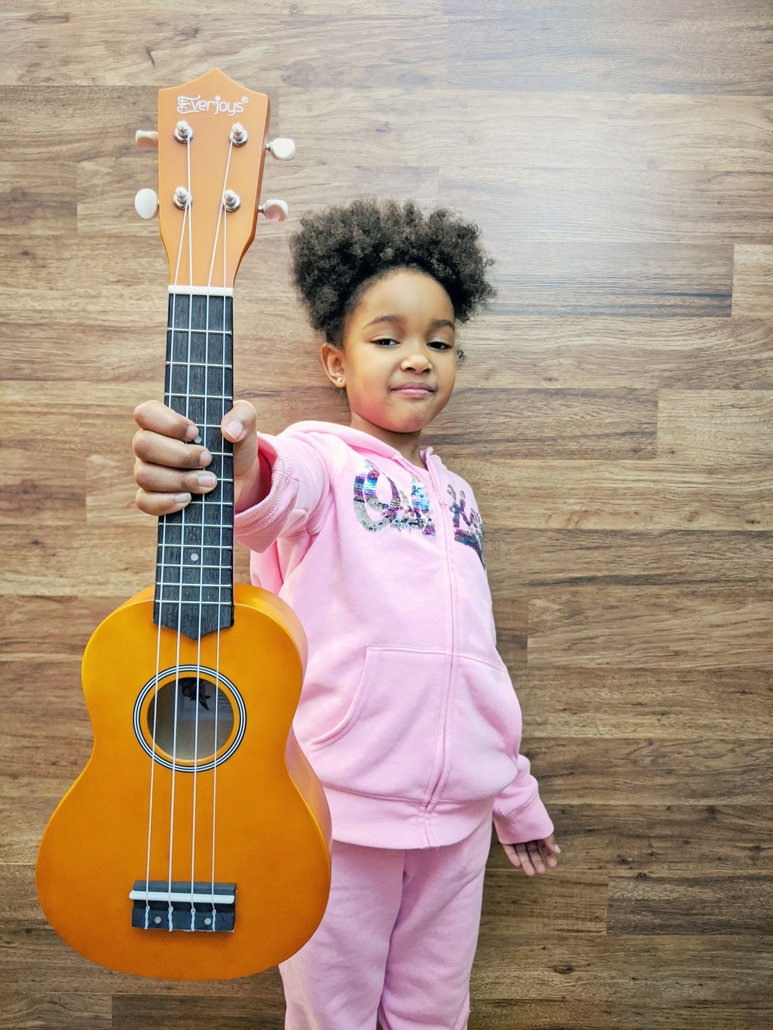 Young student holding a ukulele at Noteworthy Music Academy in West Bloomfield