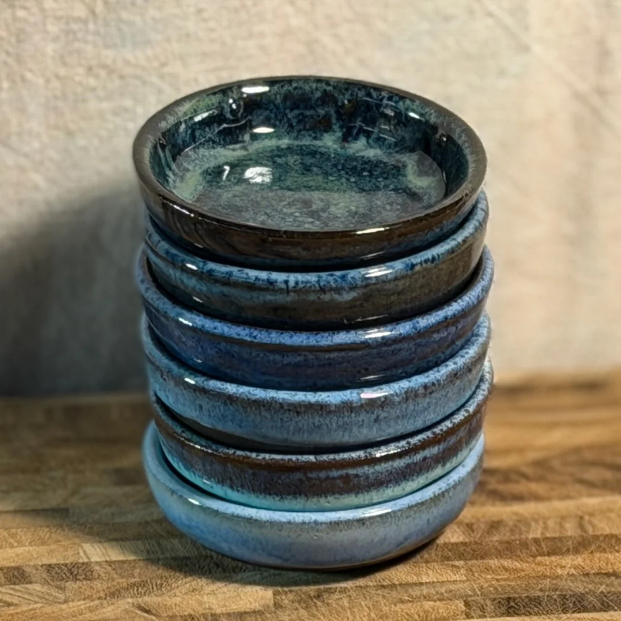 Stack of small blue bowls