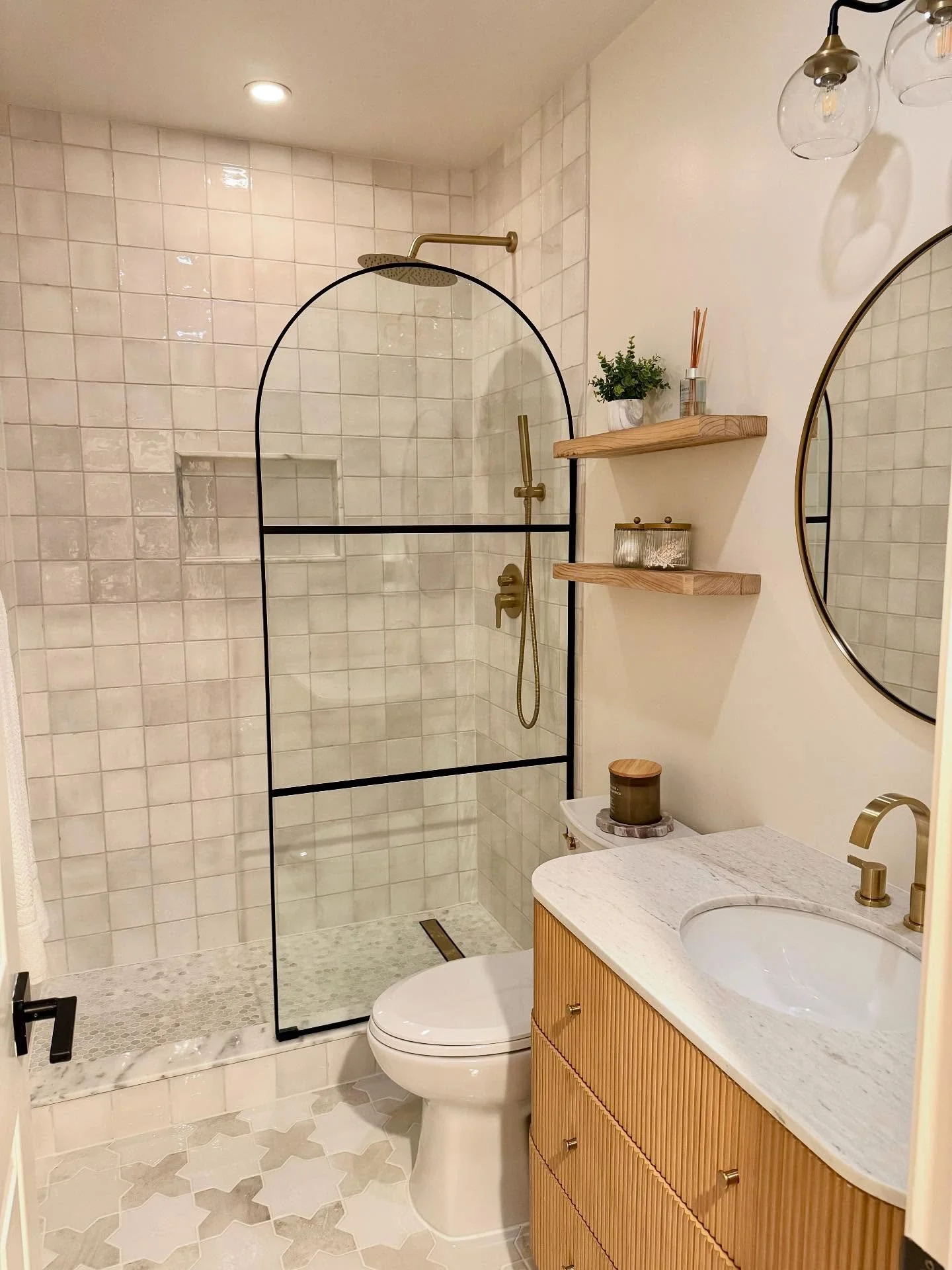 A quiet transformation in the basement&mdash;this guest bath now carries the calm and ease of a private spa. Soft textures, warm lighting, and intentional details make all the difference for your guests 🌿✨

#interiordesign #basementbathroom #guestba