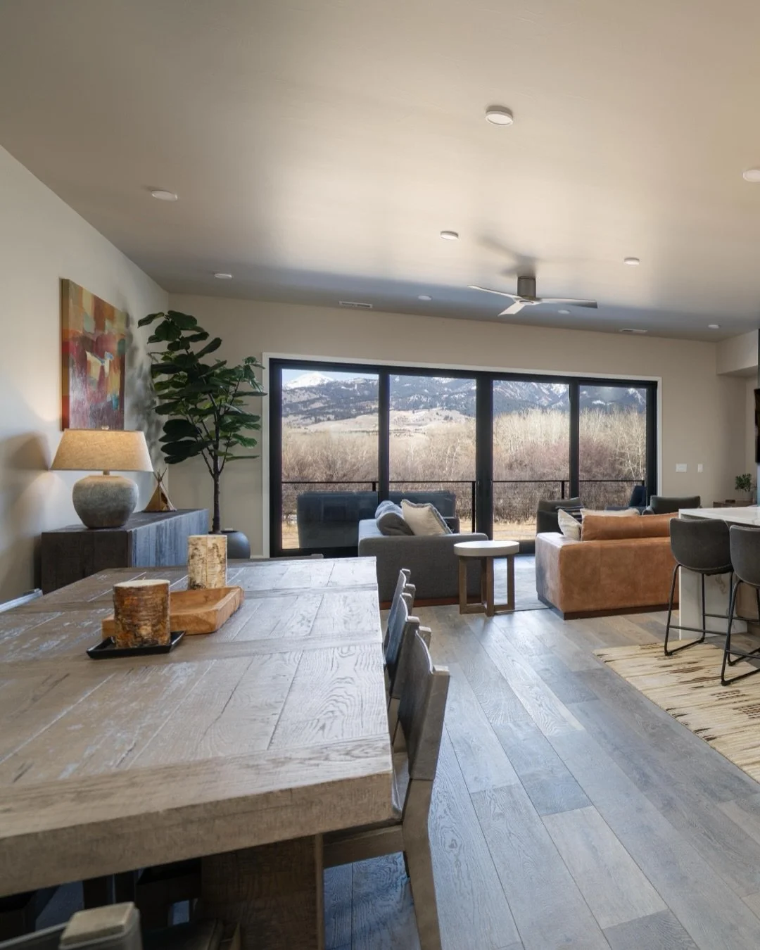Experience the best of Bozeman living in this luxury, like-new modern townhome. This like-new single owner property features an open and inviting floor plan with beautiful finishes throughout - defined by its expansive windows that capture panoramic 
