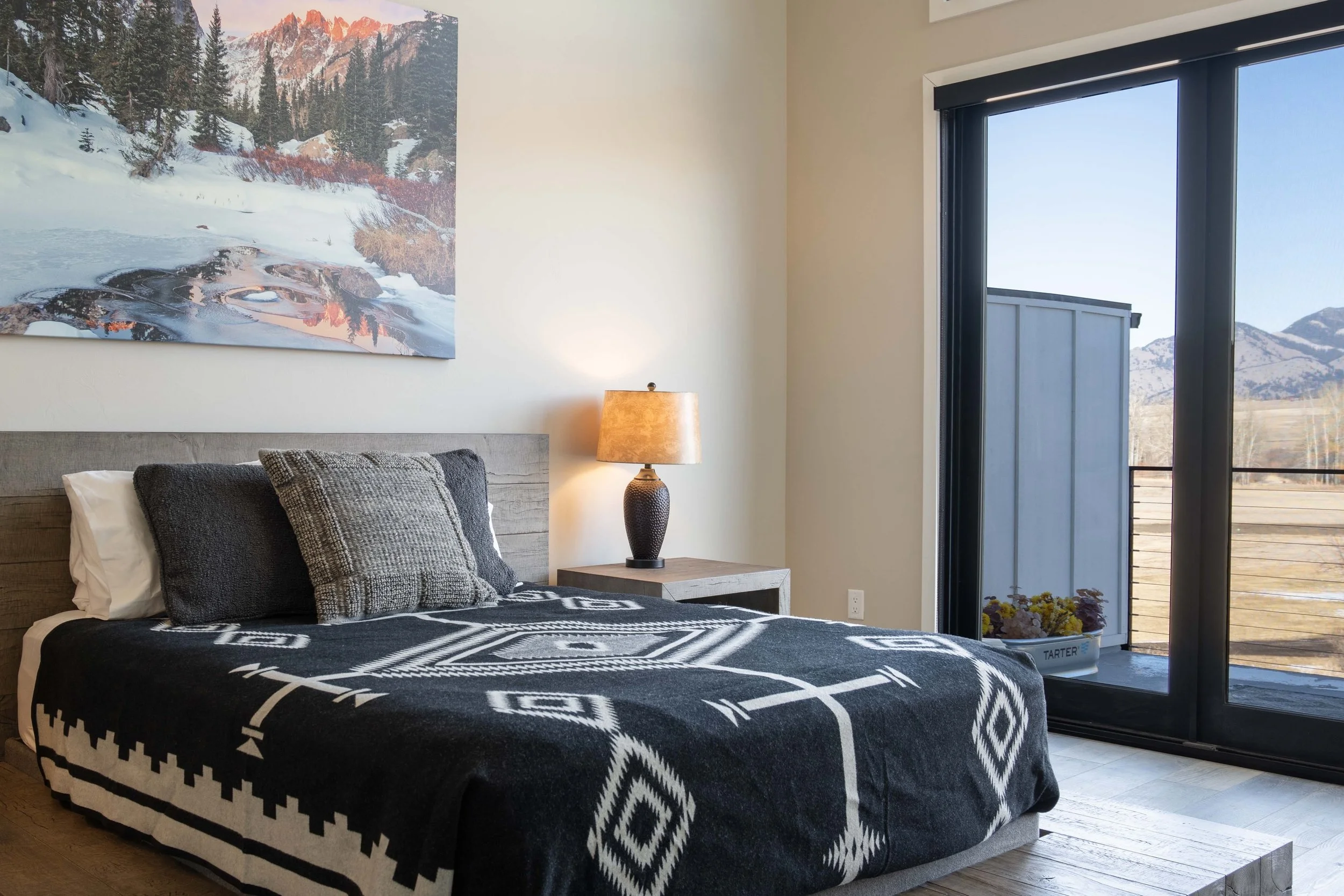 Experience the best of Bozeman living at 211 Bridger Vale Dr ✨

This luxury, like-new modern townhome offers an open, inviting floor plan with stunning finishes throughout. Expansive windows flood the space with natural light and showcase breathtakin